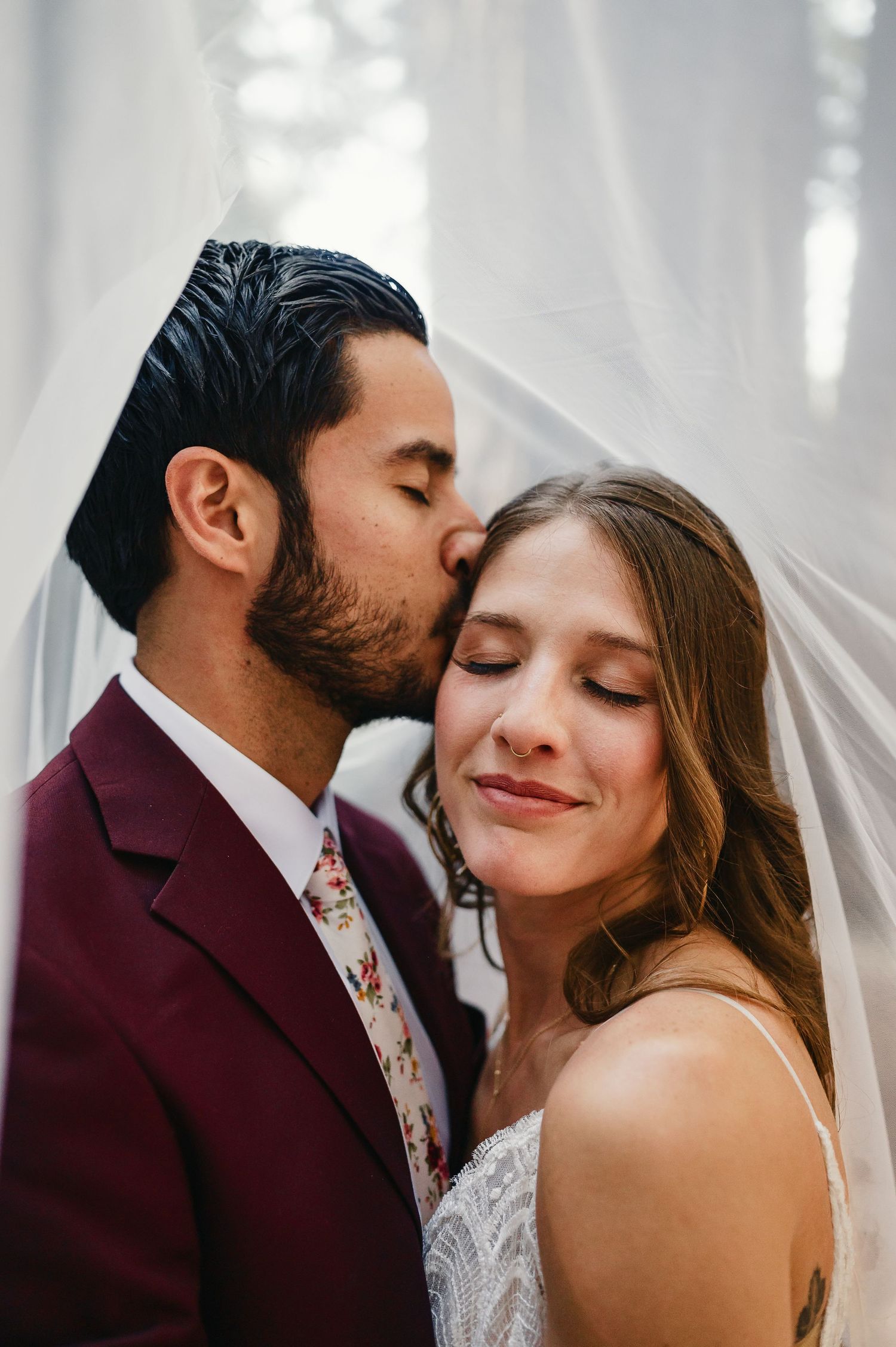 A romantic wedding couple embraces intimately under soft lighting in a series of four close-up shots.