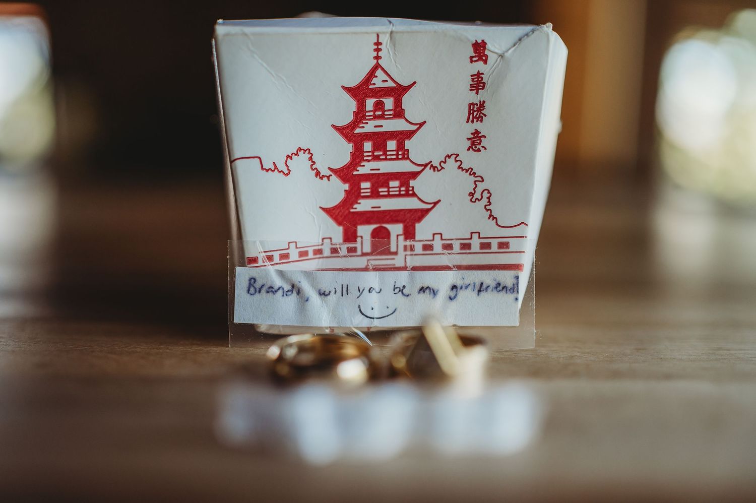 Traditional red Asian pagoda designs drawn on white paper or fabric in a minimalist style.