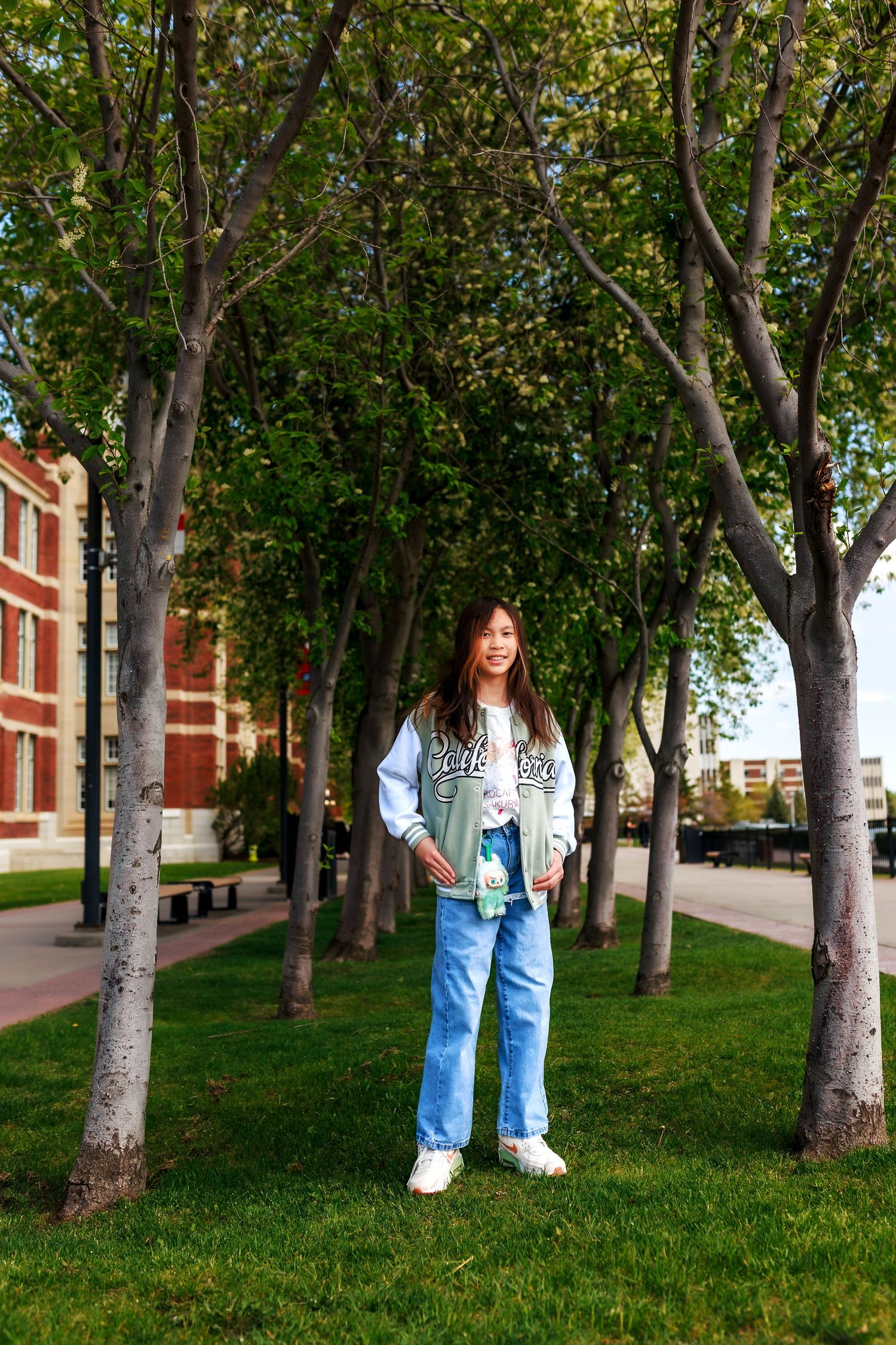 Calgary portrait photography by Doce Photography showing a girl standing at SAIT and looking at the camera.