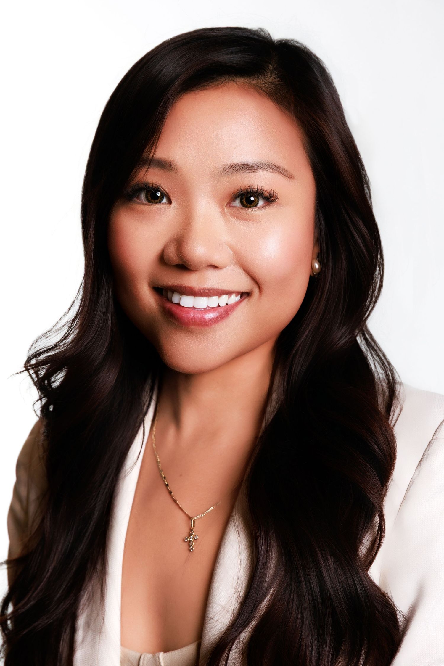 Professional headshot series showing warm smiles and long dark hair against white background in business attire.