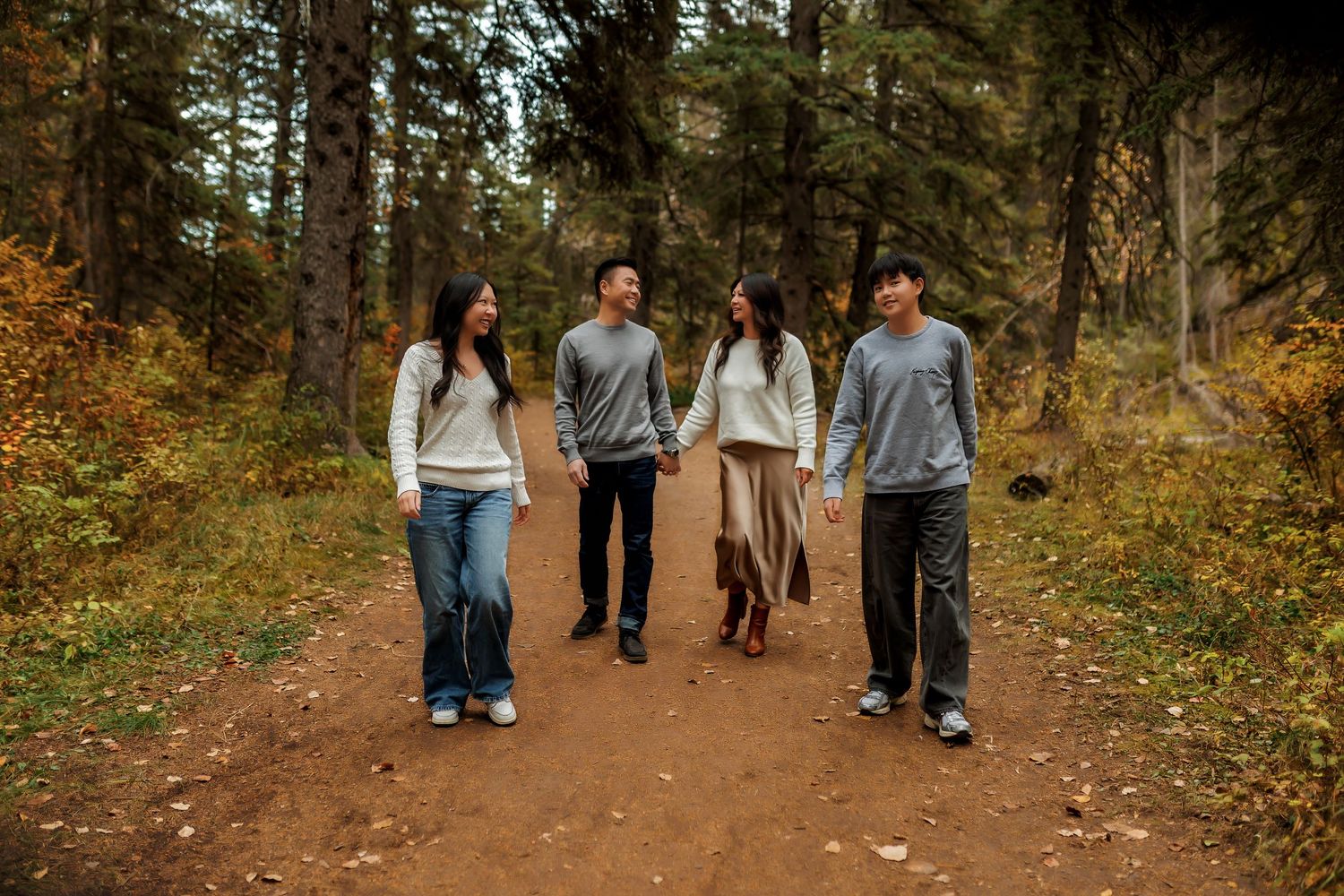 Natural light family photography session in the wooded trails of Shannon Terrace Park, Calgary.
