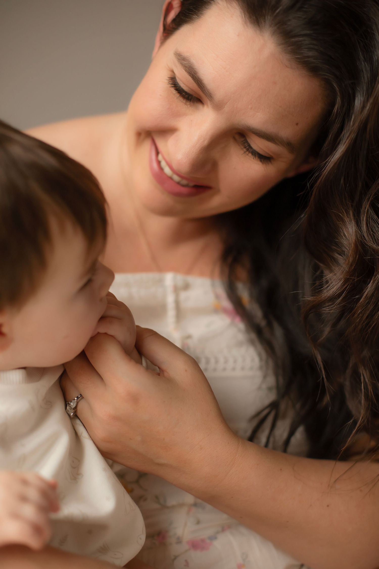 Intimate close-up shots showing tender moments of affection and connection between family members.