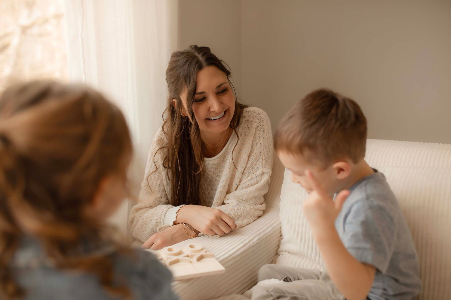 A series of connected images showing someone helping a child with homework or schoolwork at a desk.