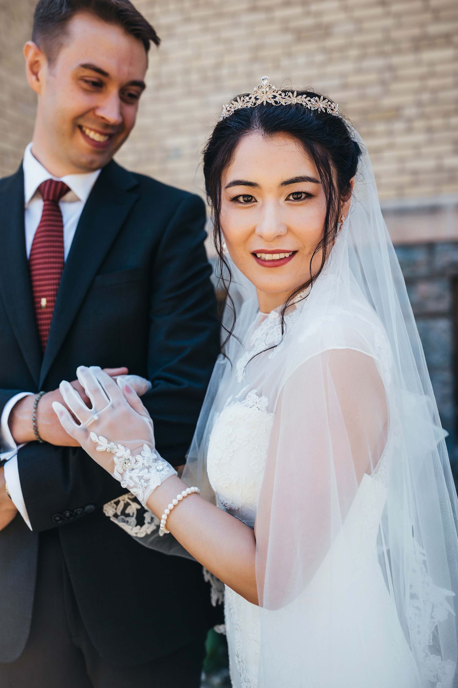 Romantic wedding portrait showing couple's joy and elegant attire.