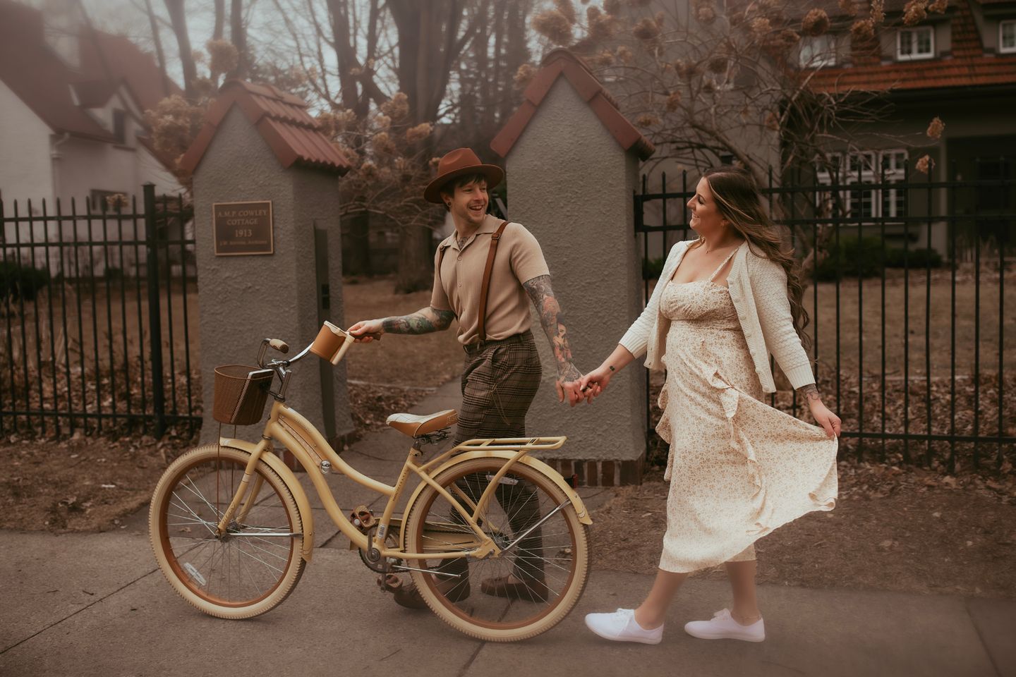 Vintage bicycle on a cobblestone street with autumn leaves and brick buildings in the background. Minneapolis Willow & Wren Photography.