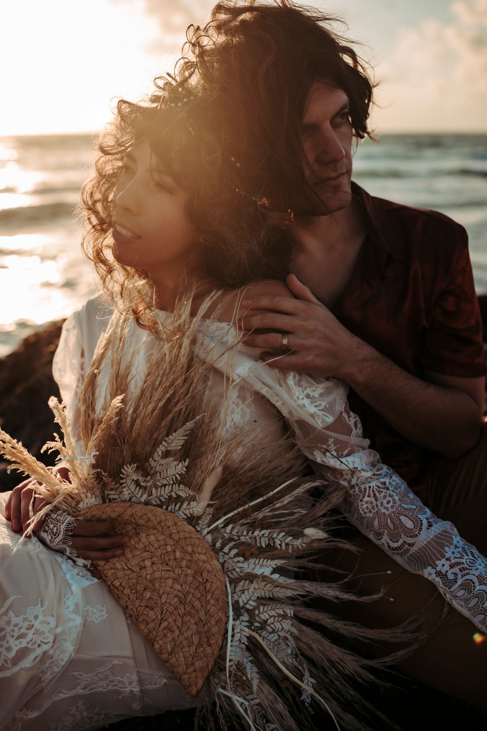 Sunset beach portrait with lace dress details and dried pampas grass bouquet.