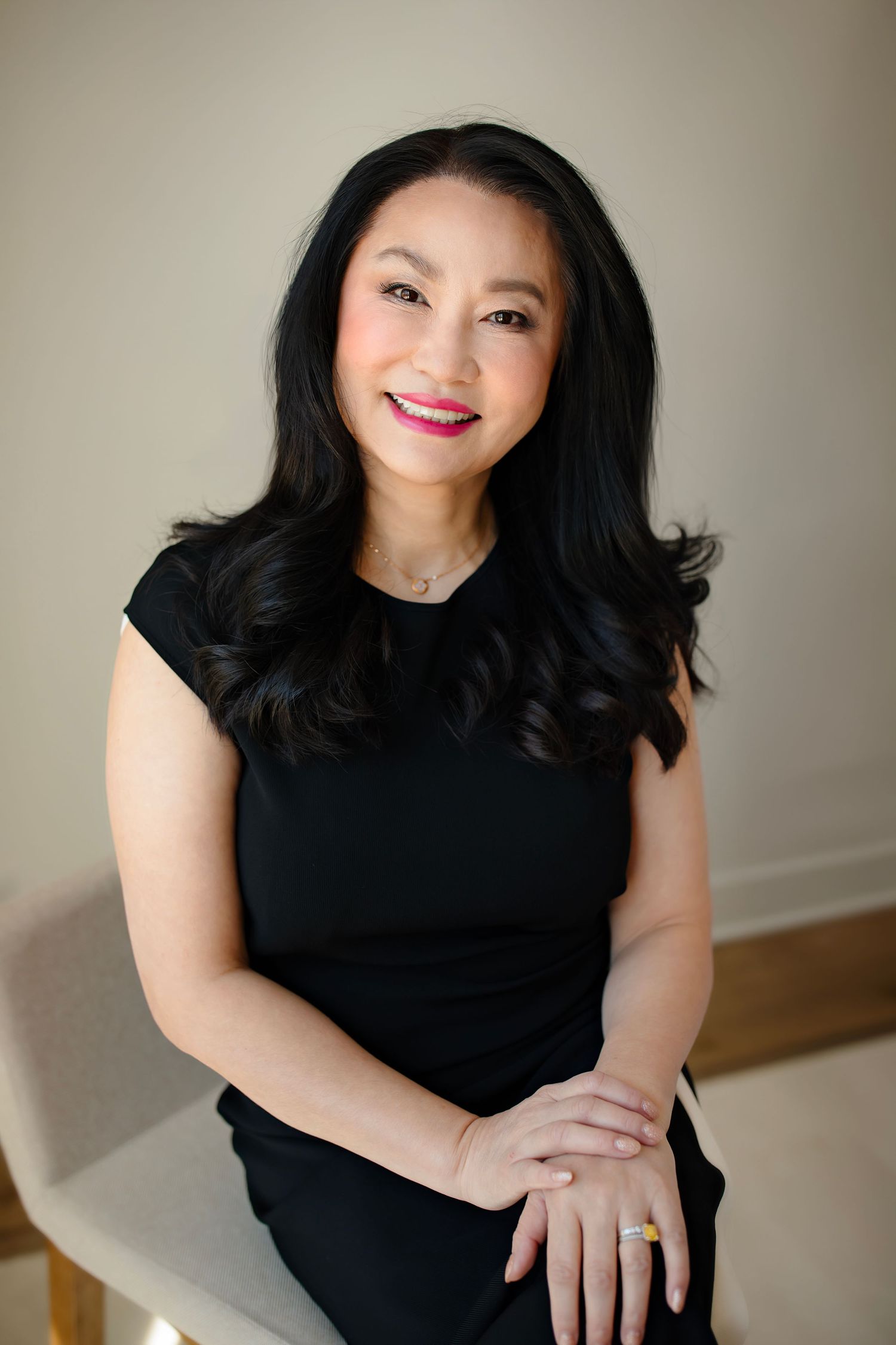 A collection of portrait shots featuring someone wearing a black top against a neutral background.