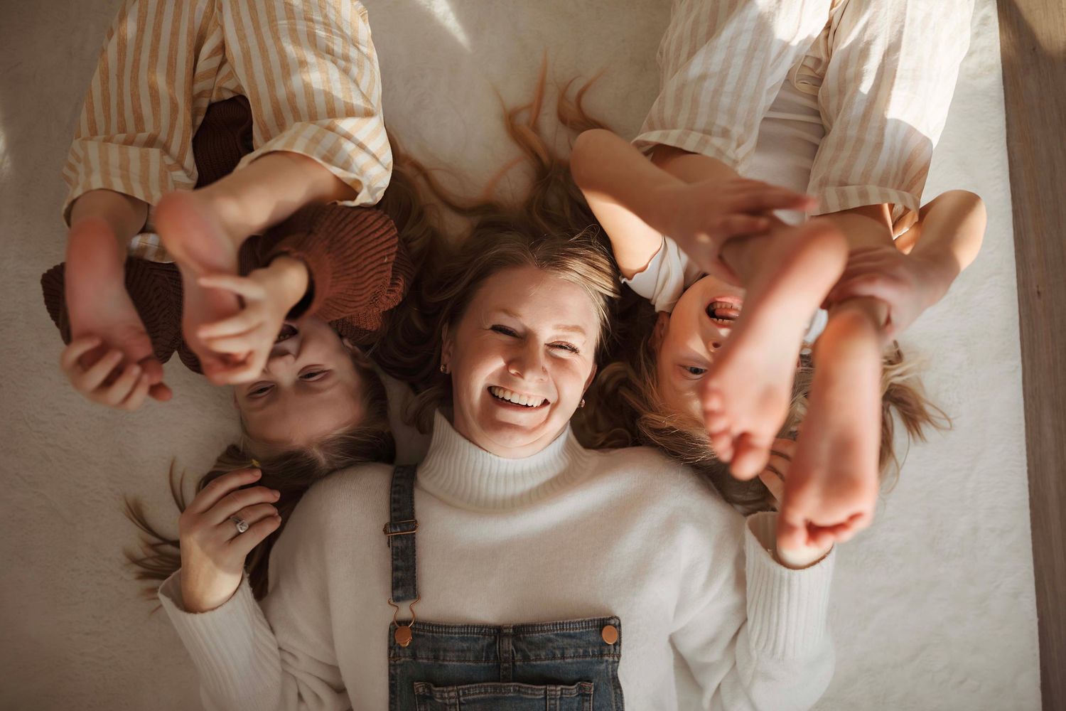 A collection of intimate lifestyle photographs showing people embracing and cuddling together in casual indoor settings.