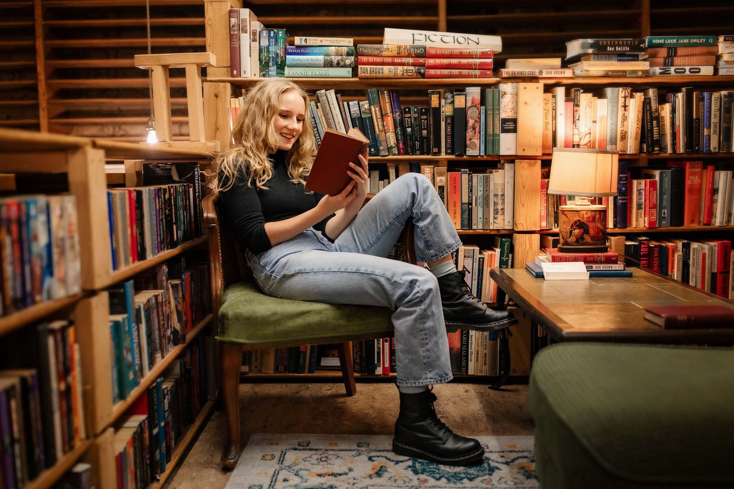 Relaxed reading scene in cozy library corner with vintage bookshelves.
