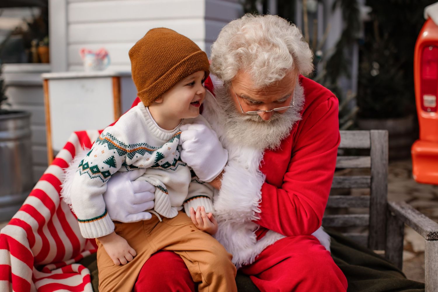 Festive winter scene with traditional red and white holiday attire and decorative stripes.