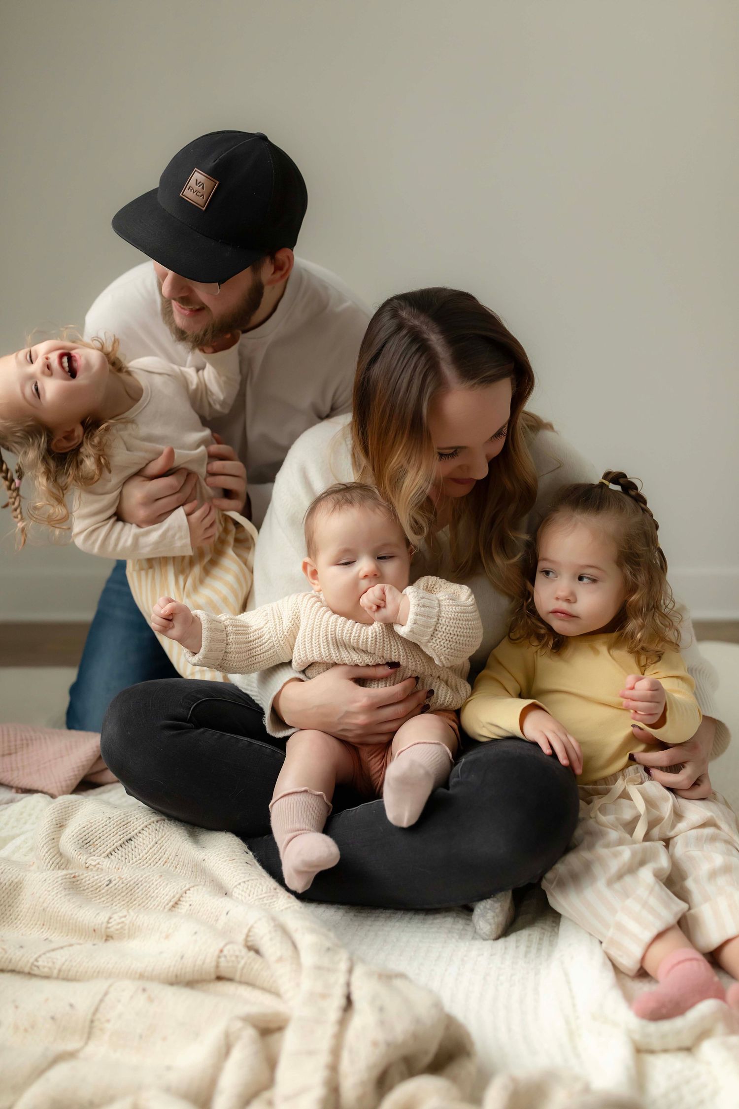 Candid family moment with playful interactions with Willow & Wren Photography.