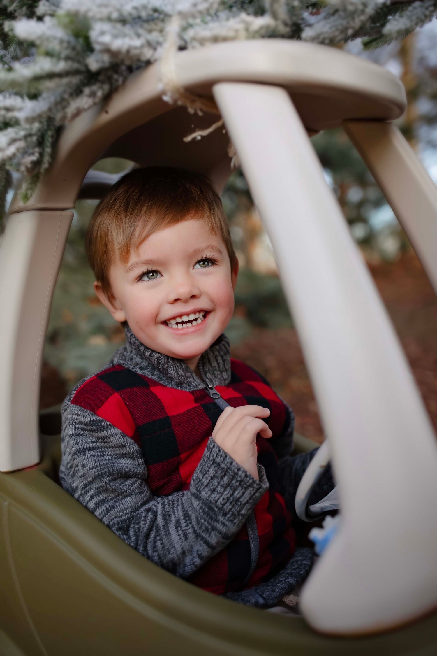 Close up of joyful moment in decorated toy car during winter holiday season.