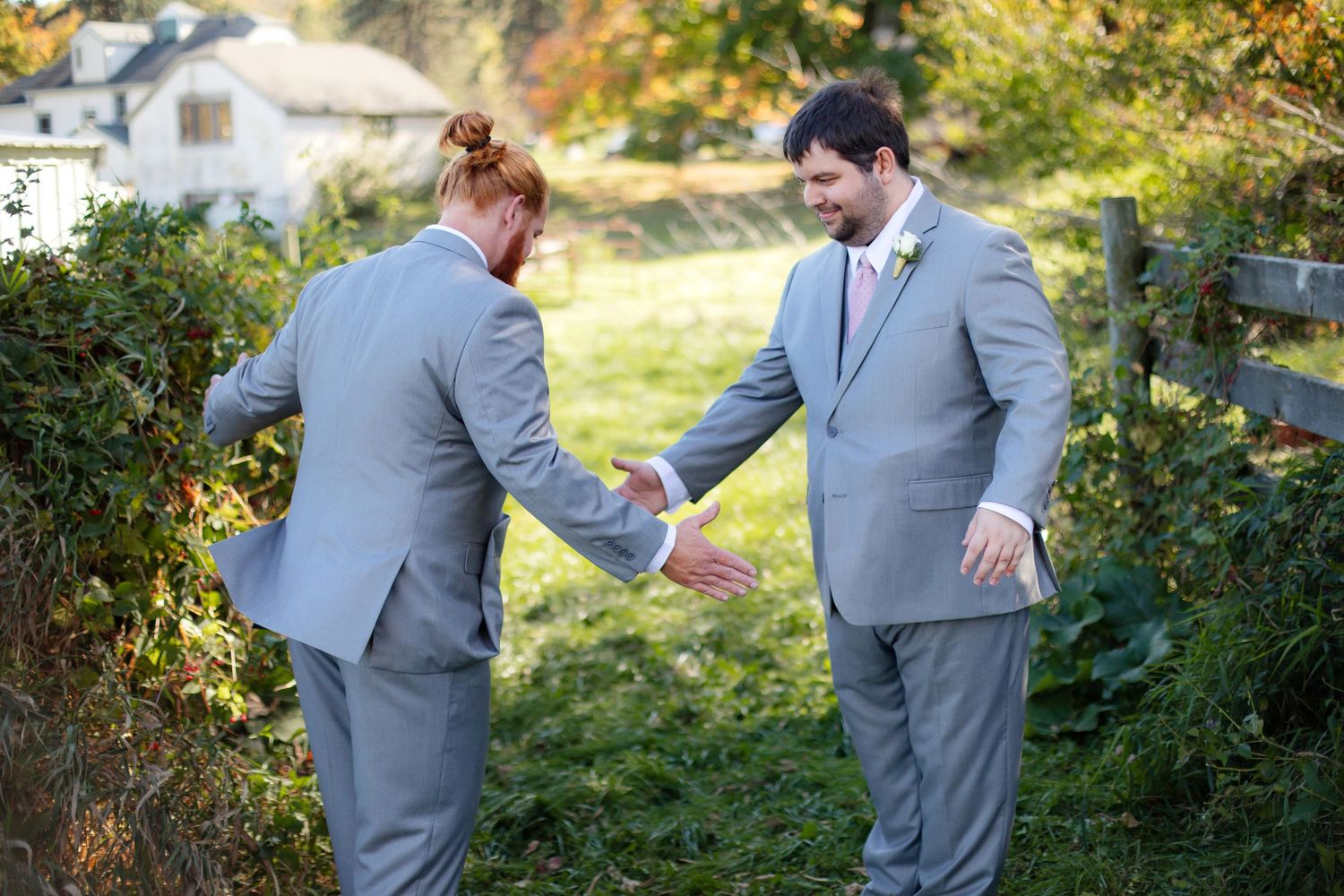 Wedding party reacting with excitement and laughter during outdoor ceremony.