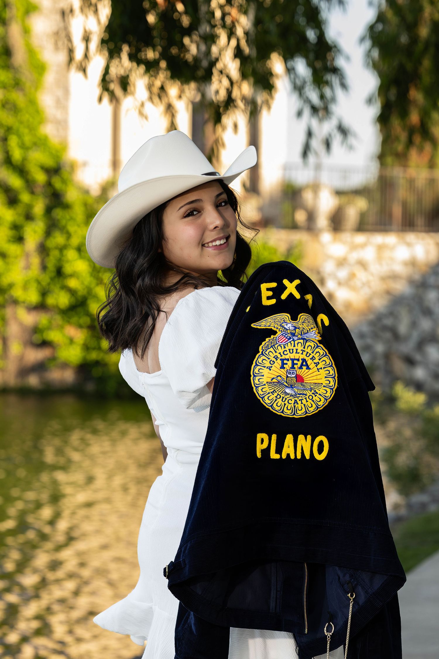 FFA jacket display showing Plano chapter emblem against natural outdoor background.
