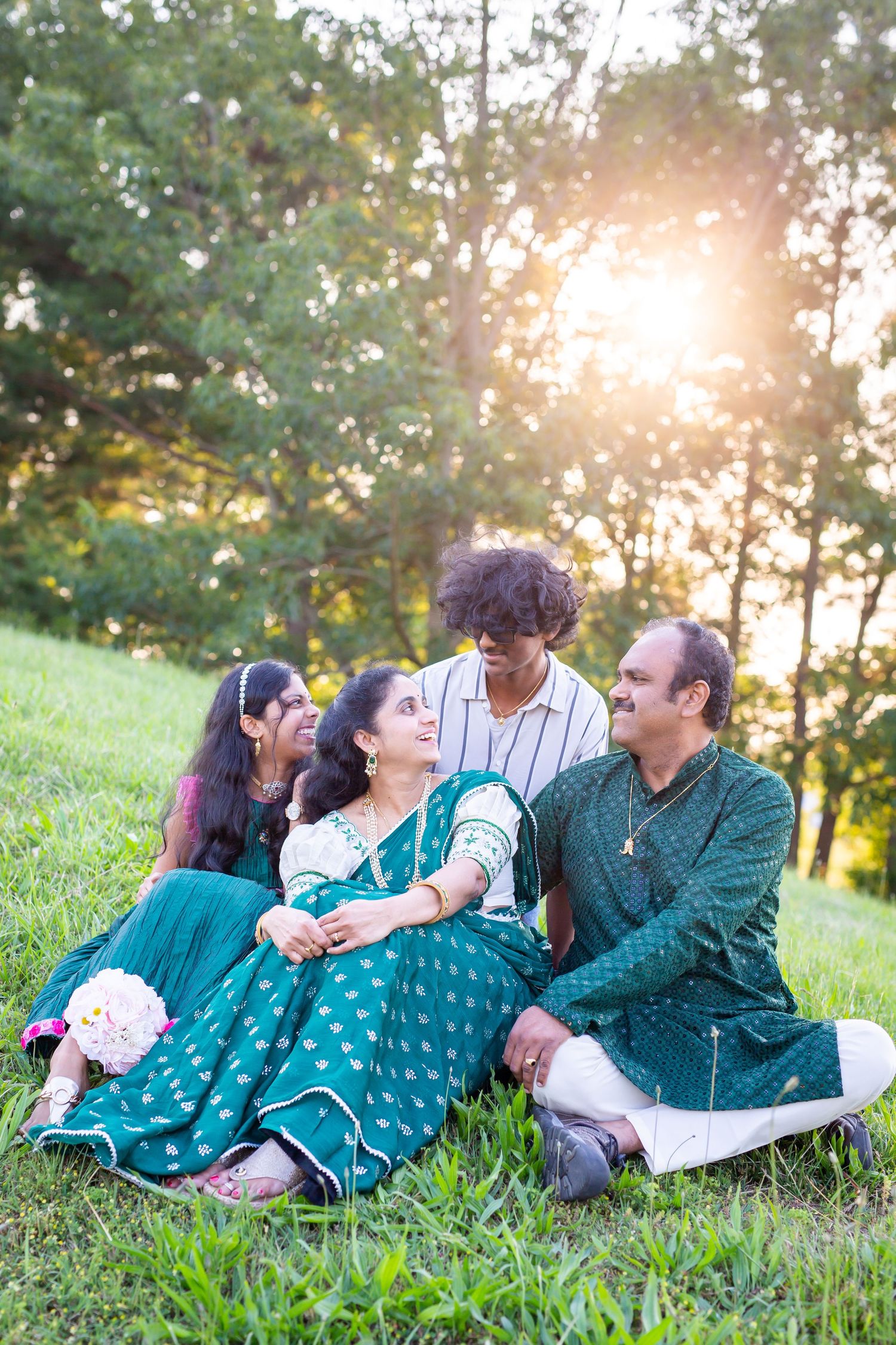 indian family as the sun sets behind them delmar delaware family photography by ashley chance otter creek acres