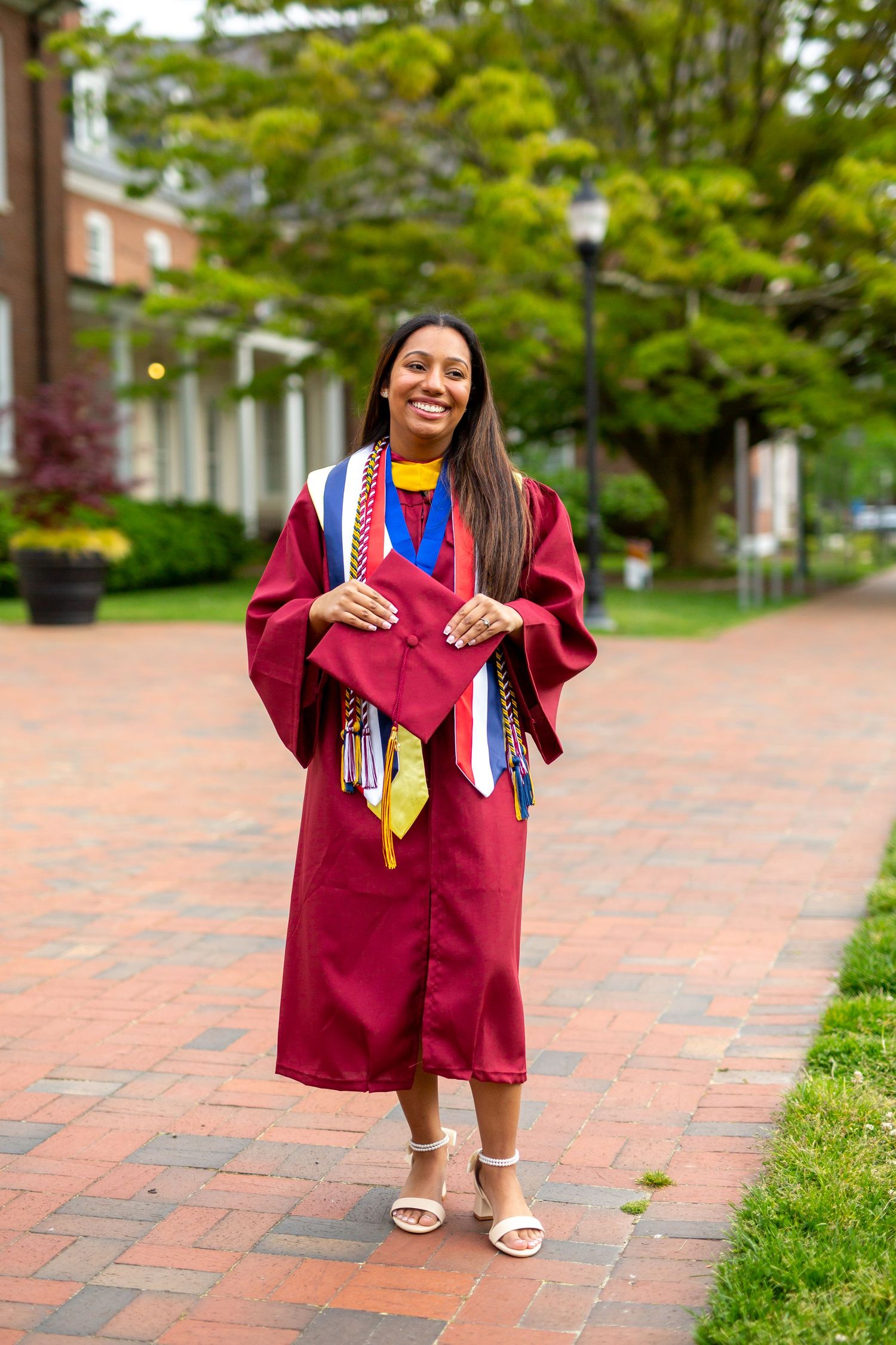 college graduate in robe with cap salisbury university graduate photography by ashley chance