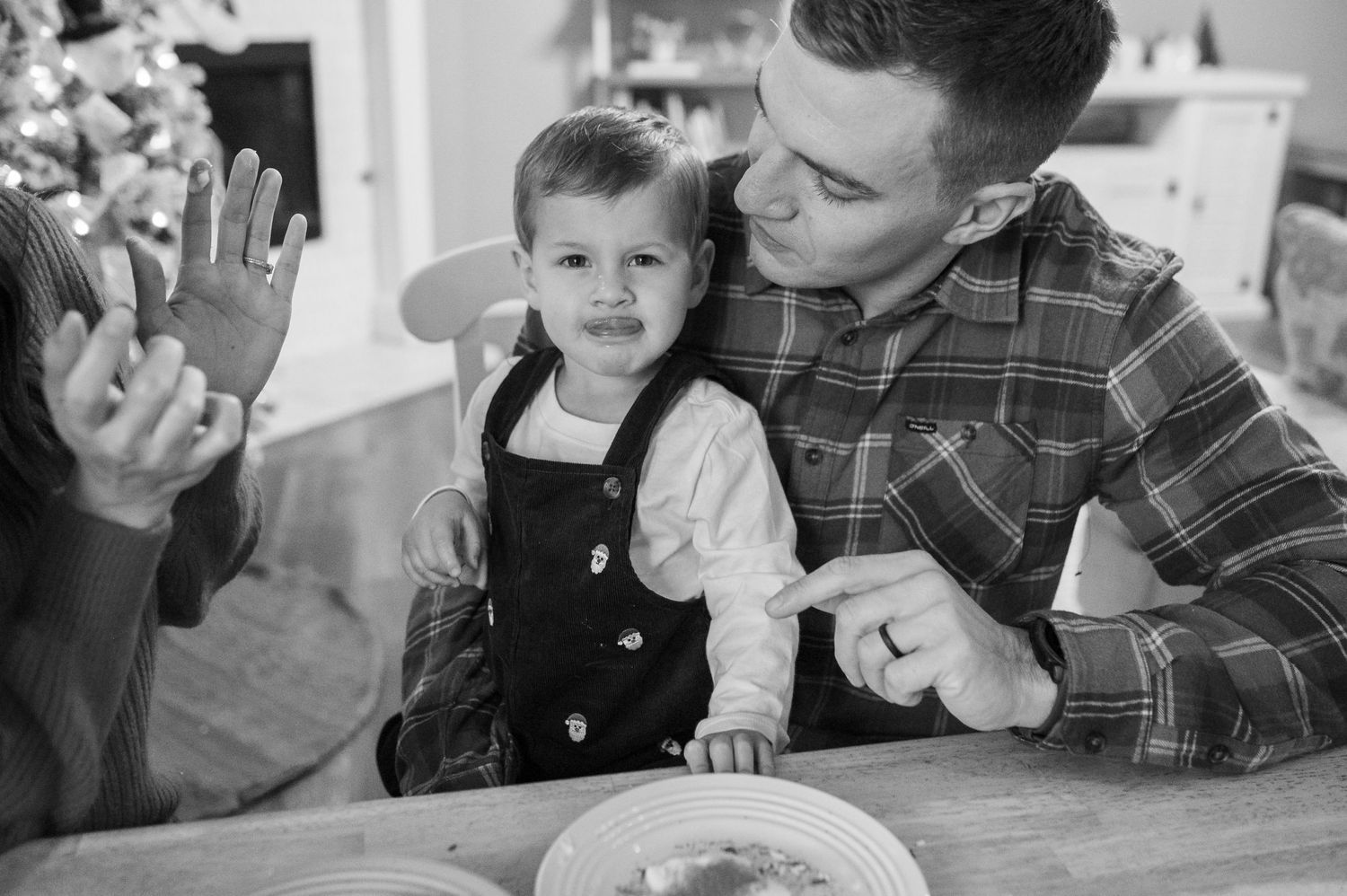 A heartwarming moment shared during a family meal at the dining table.