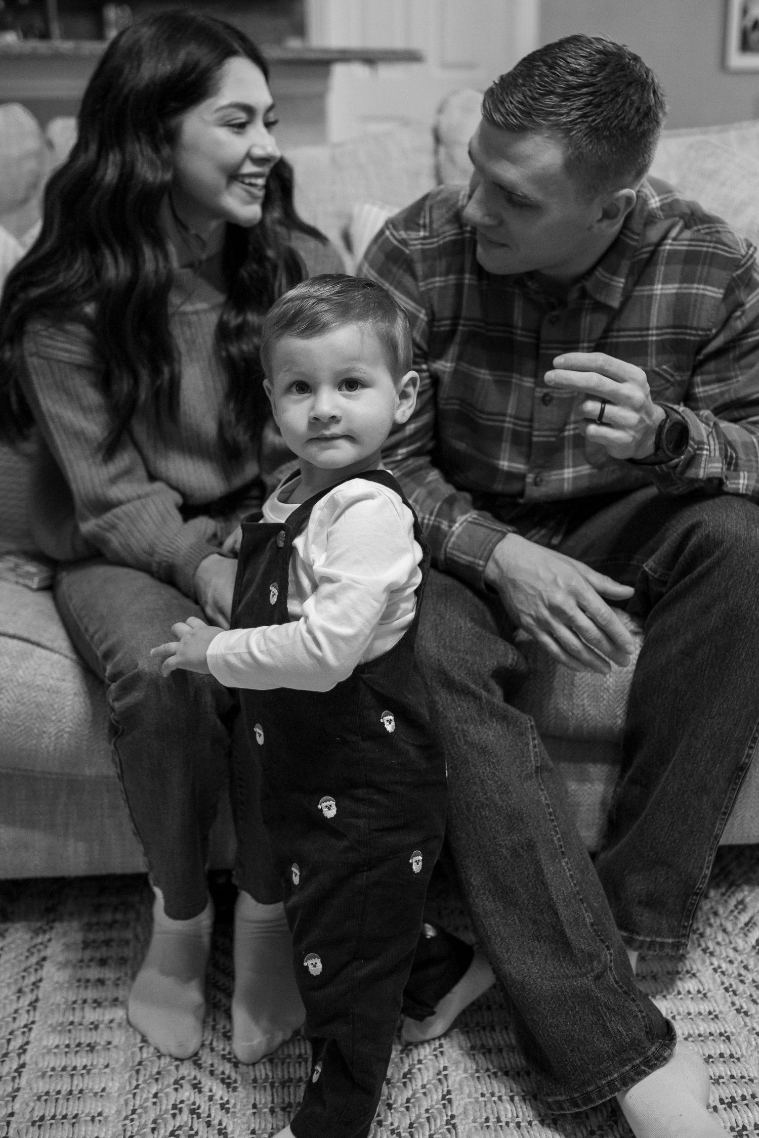 A candid family moment captured on a couch during the holiday season.