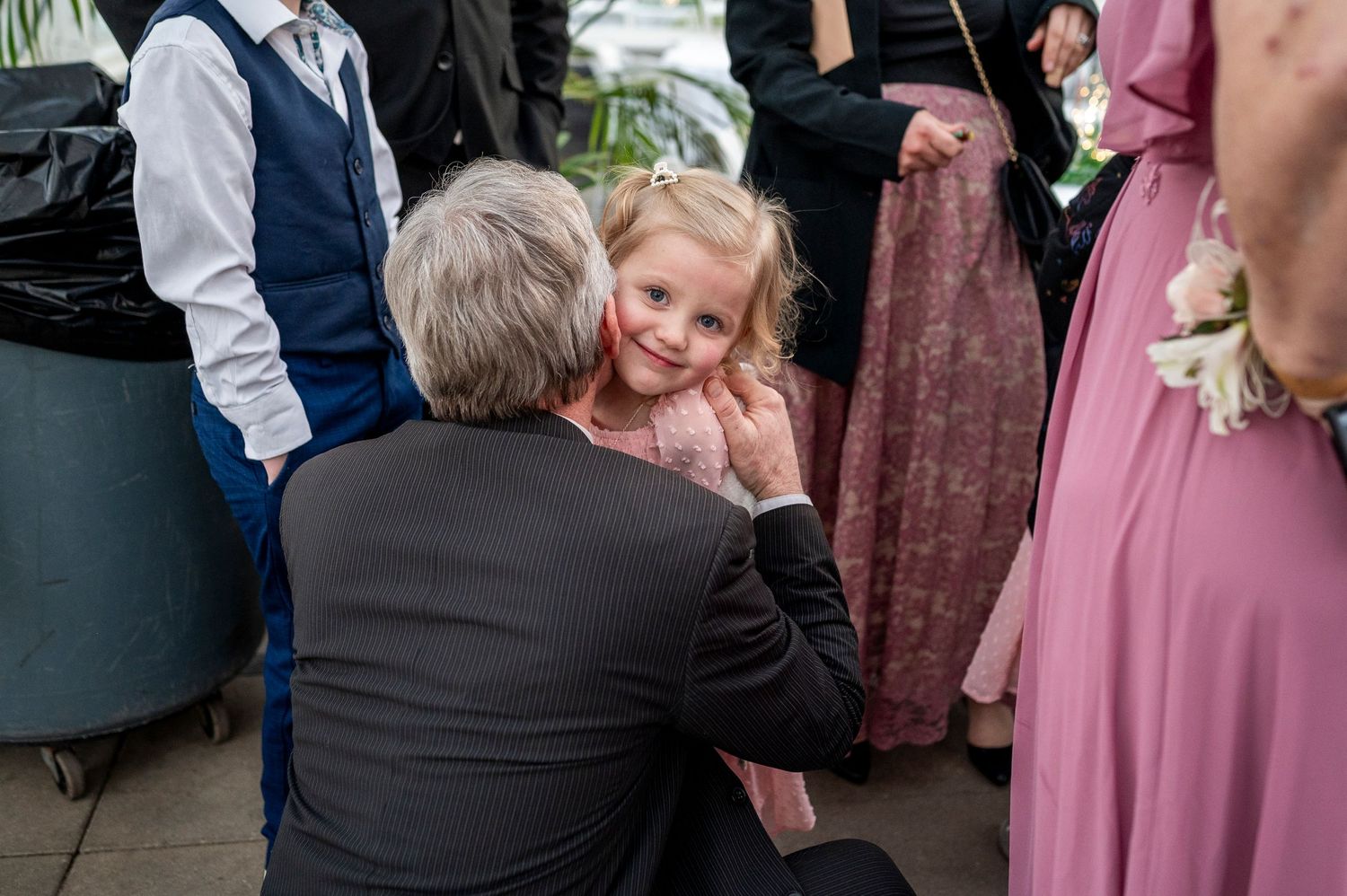 A heartwarming conversation takes place during what appears to be a formal gathering.