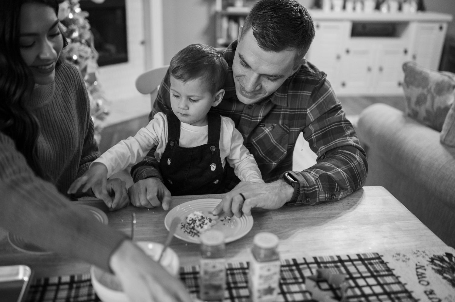 A family enjoying a meal together at a table during the holidays.