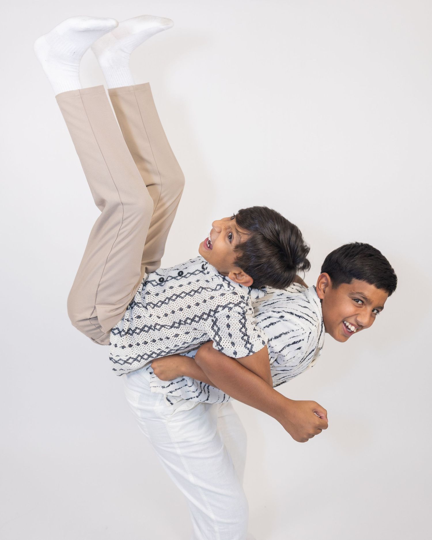 Series of dynamic poses showing acrobatic movement against white background.