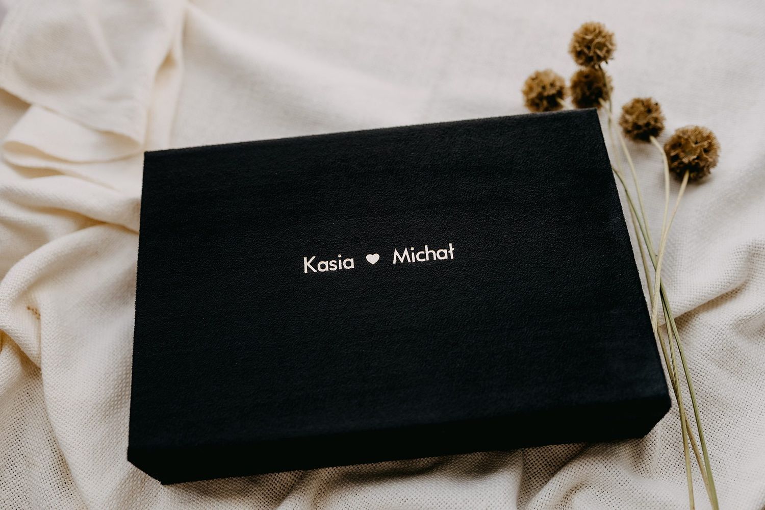 Black wedding photo keepsake box with silver foil text reading Kasia and Michal.