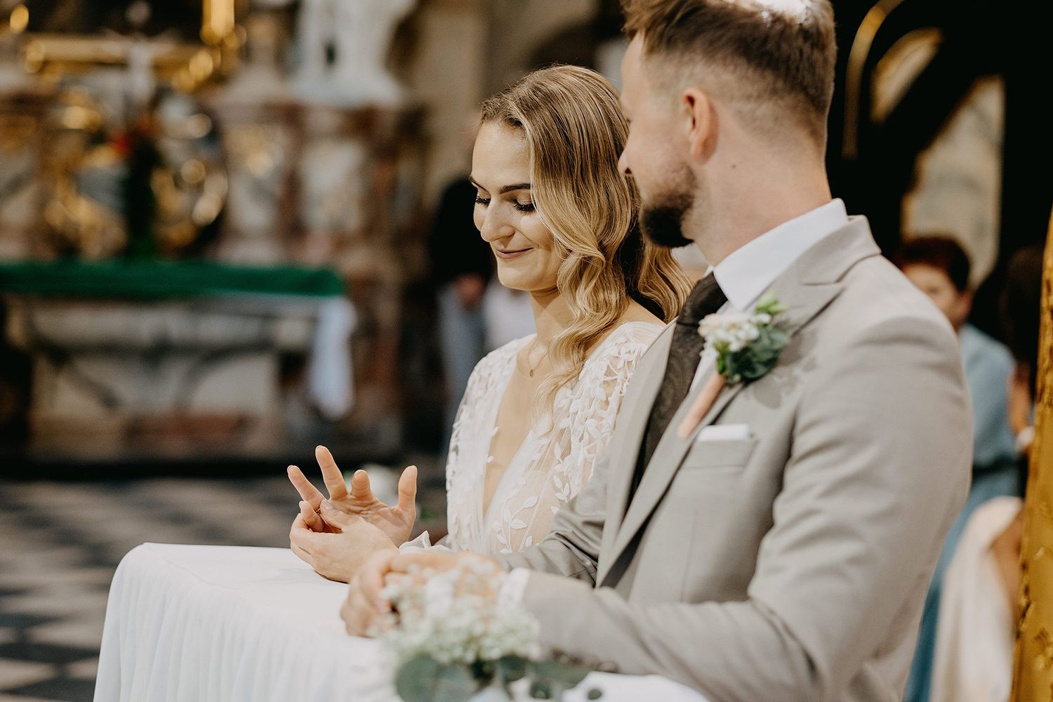 Bride and groom exchanging rings during a beautiful church wedding ceremony.