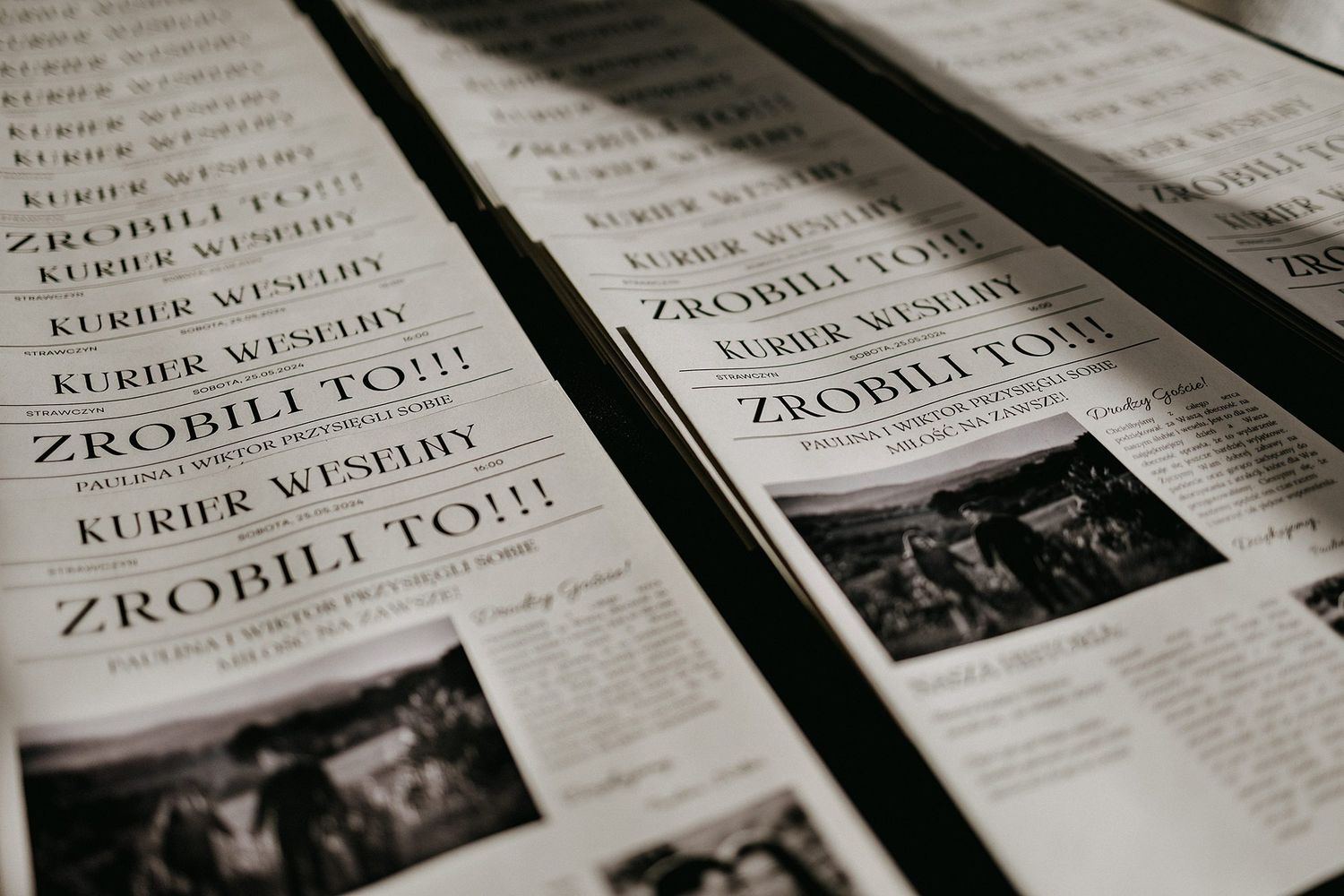 Wedding newspapers titled Kurier Weselny with headline Zrobili To laid out in rows.