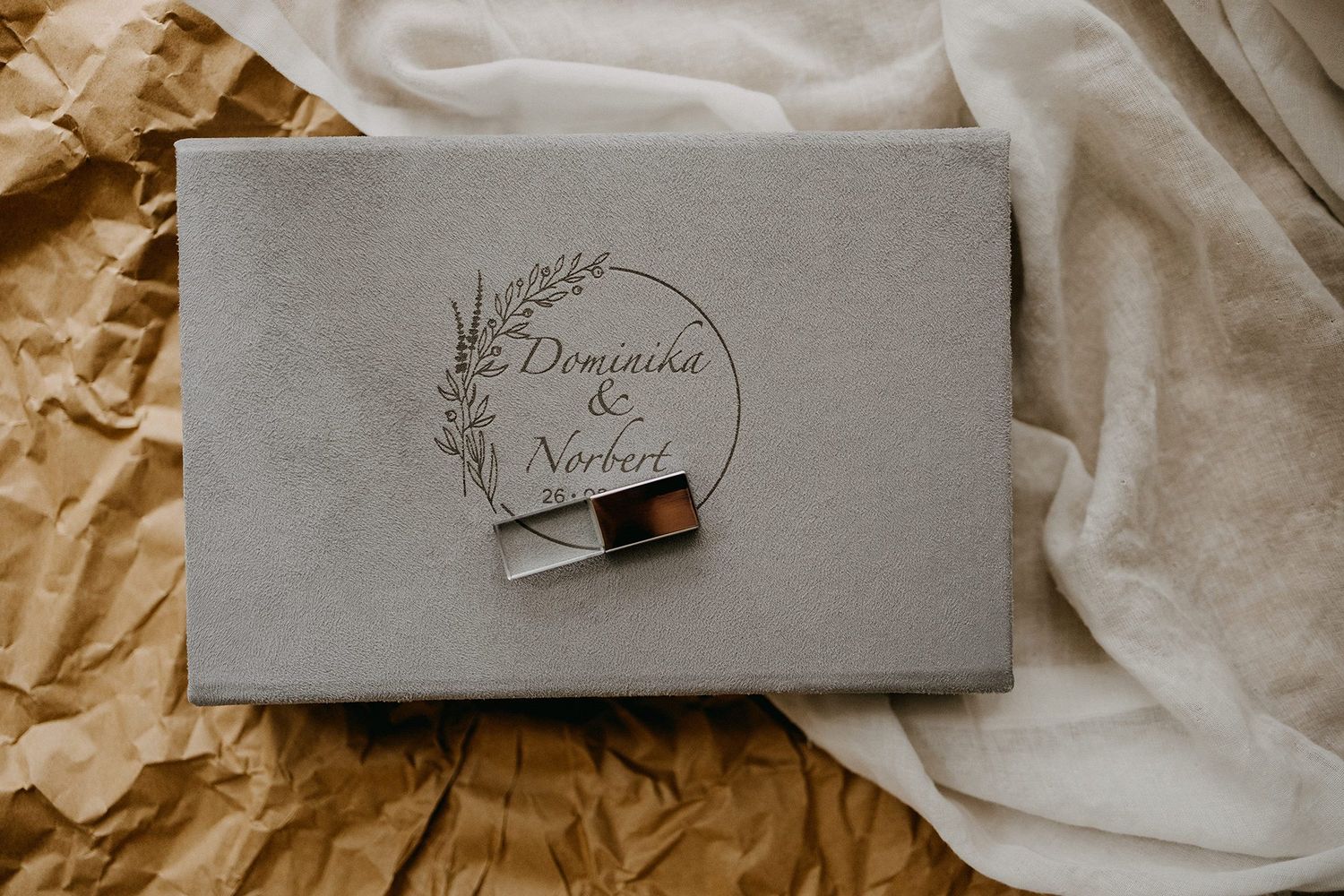 Gray velvet wedding box engraved with Dominika & Norbert floral design with USB drive.