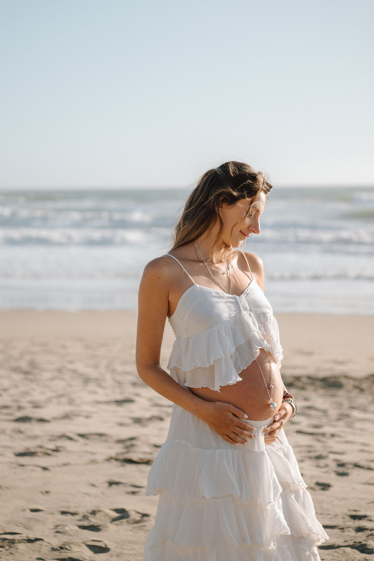 mom to be at bay area beach golden hour maternity photo session in Daly City