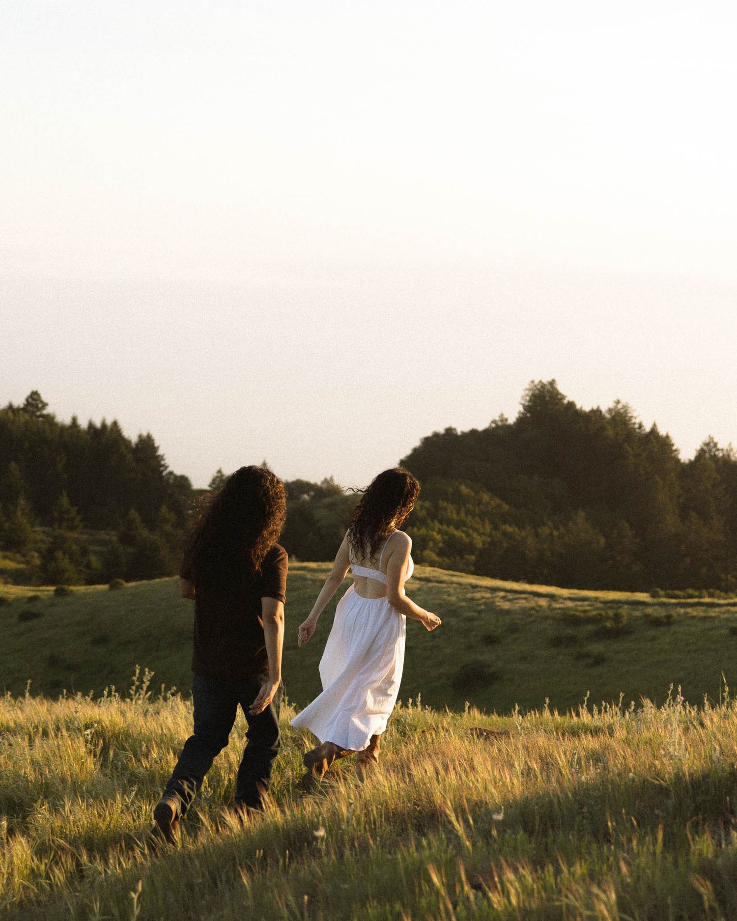 Cinematic couples photography session overlooking the California coastline by a Bay Area engagement photographer.