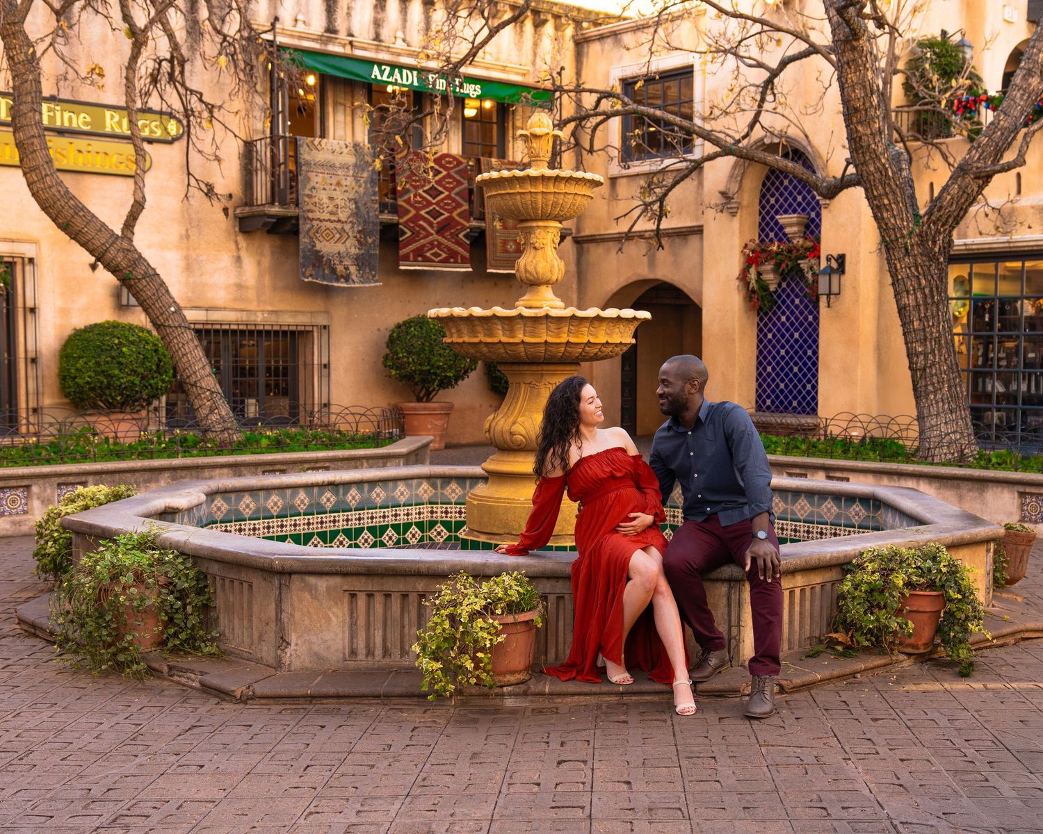 Historic Spanish colonial architecture with stone pathways and decorative details at sunset.