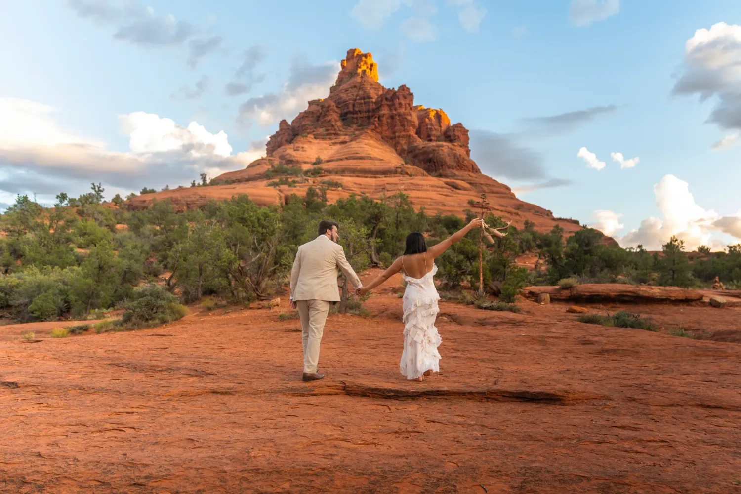 Engagement couple photos at Bell Rock in Sedona, Arizona during a scenic red rock wedding session