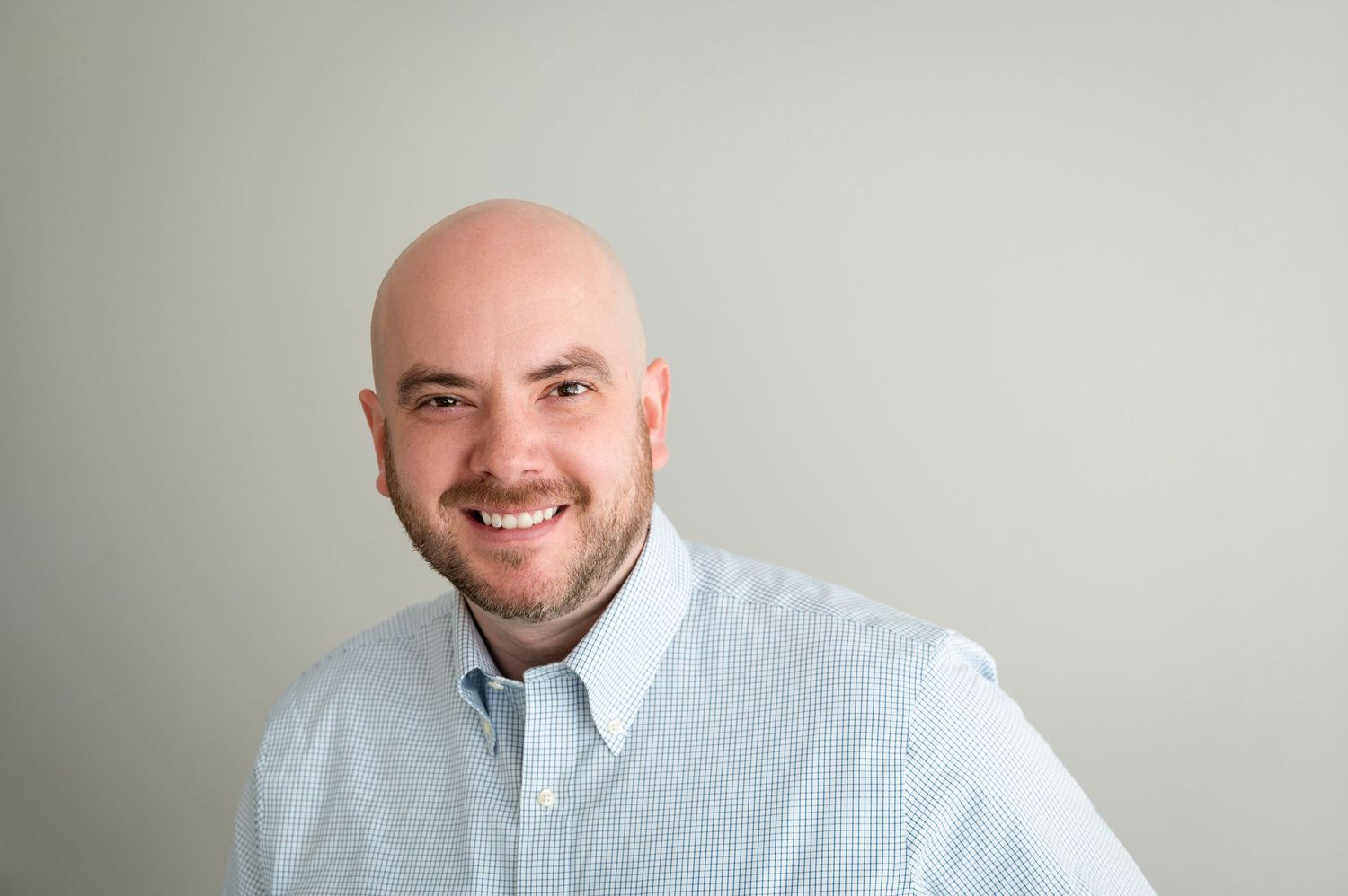 A professional headshot.