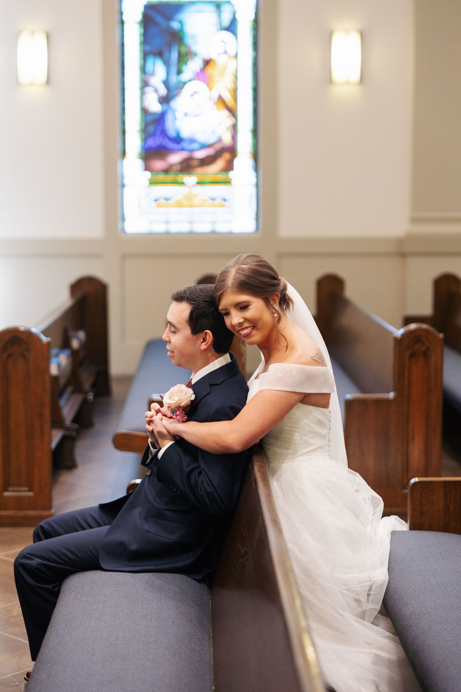 Kansas City Catholic Wedding Photographer St. Ann's Church in Prairie Village Bride and Groom Praying Together