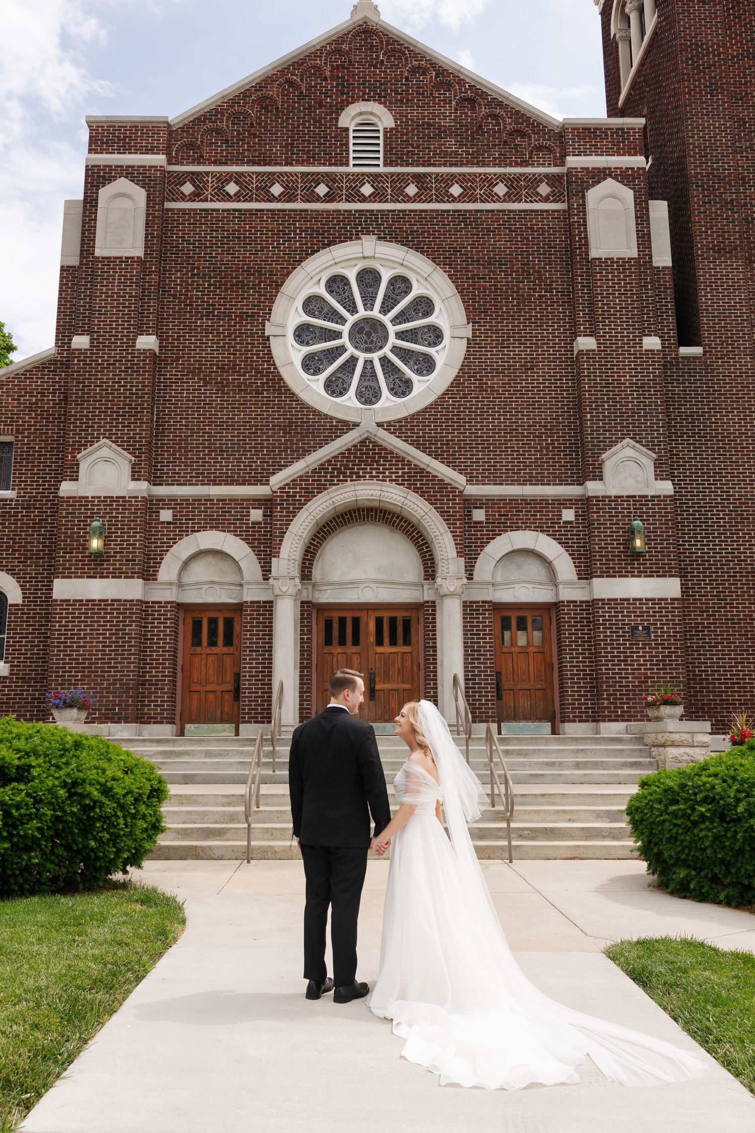Kansas City Catholic Wedding Couple Portraits in front of Classic Church