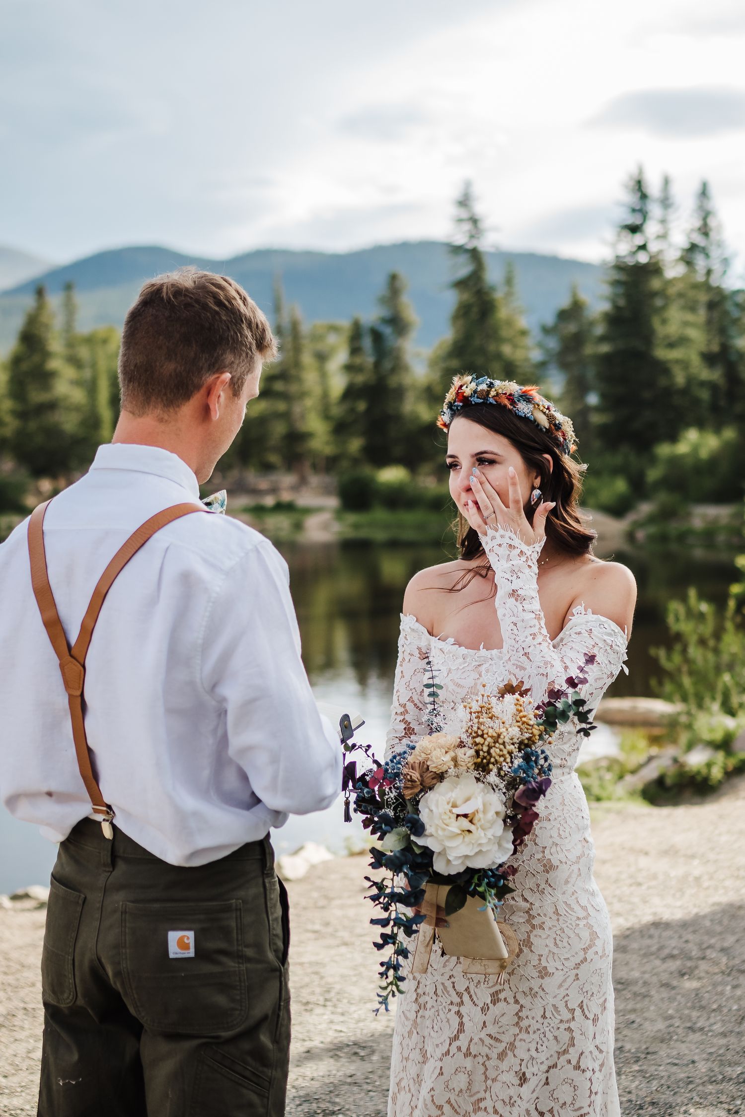 a bride wiping a tear during a private elopement ceremony