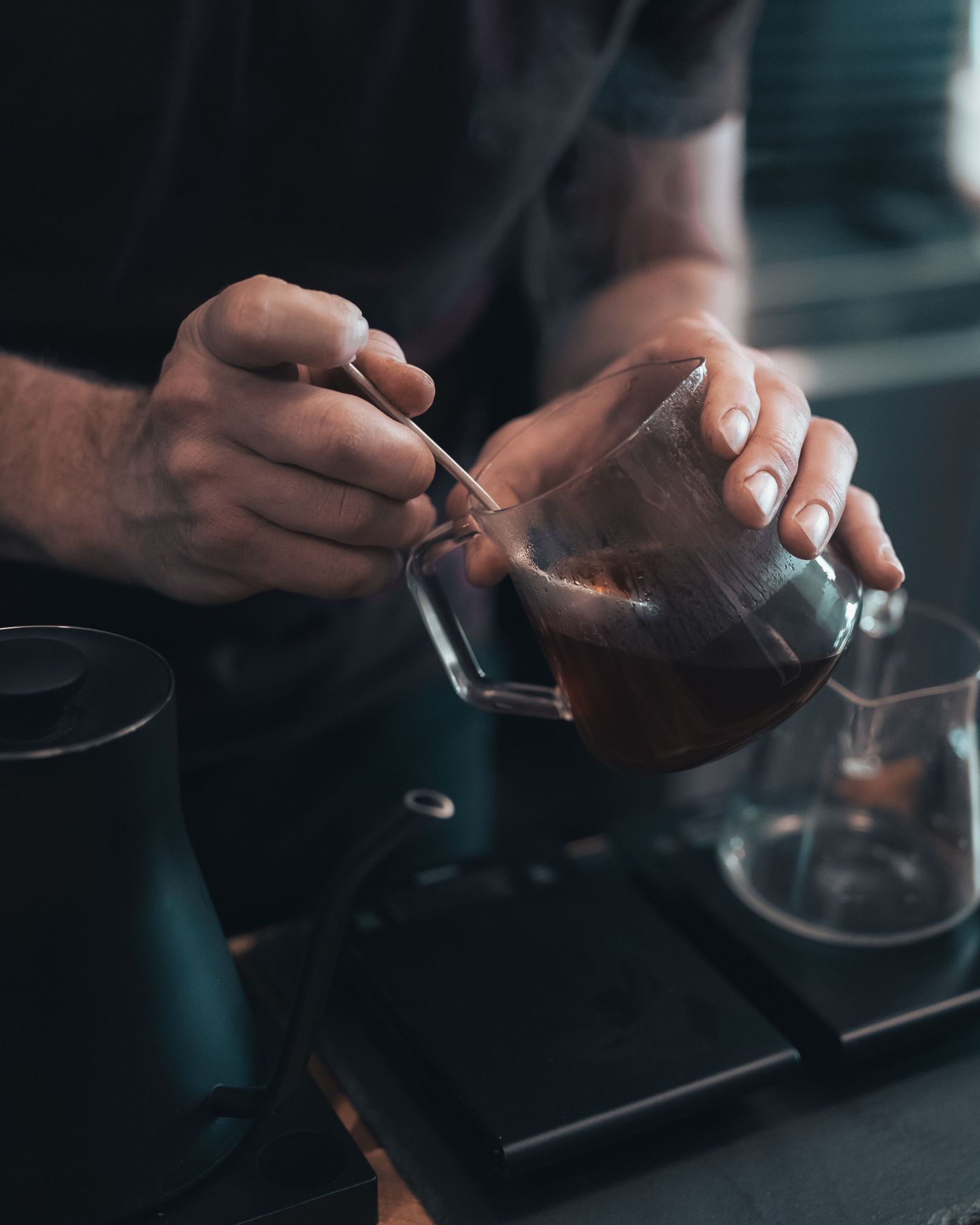 Barista preparing a hand-brewed coffee at Klerje Coffee in East Austin