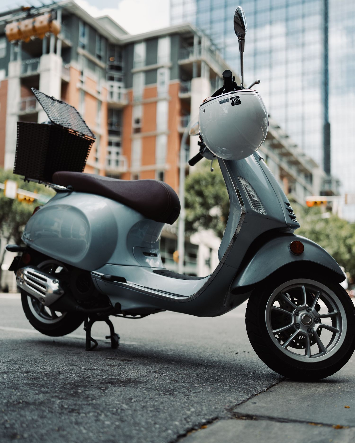 Vespa scooter parked along a downtown Austin street