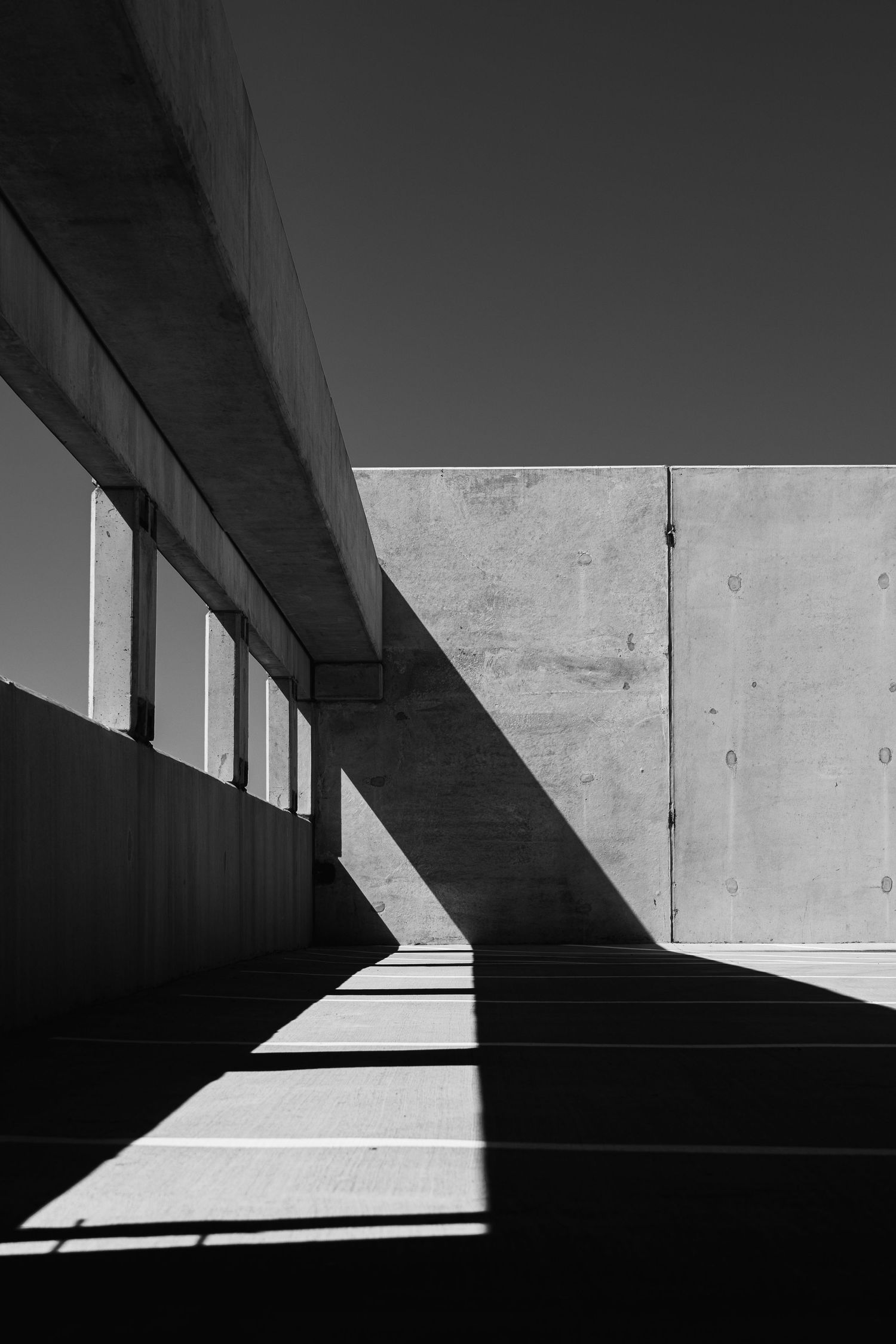Geometric light and shadow inside a parking structure near Mueller Lake Park in Austin, Texas