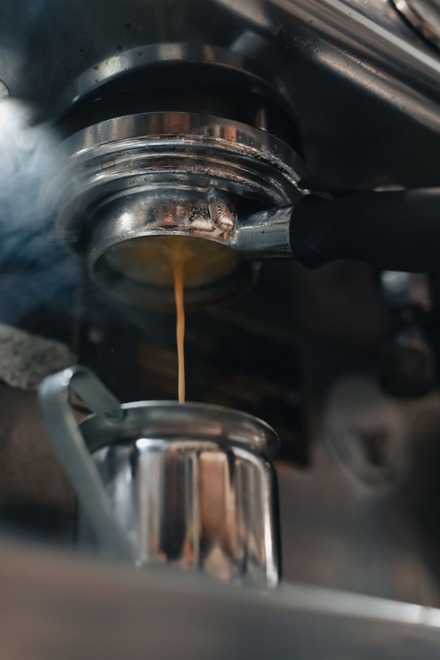 Espresso extraction into a metal pitcher at Halcyon Coffee, Bar & Lounge in downtown Austin