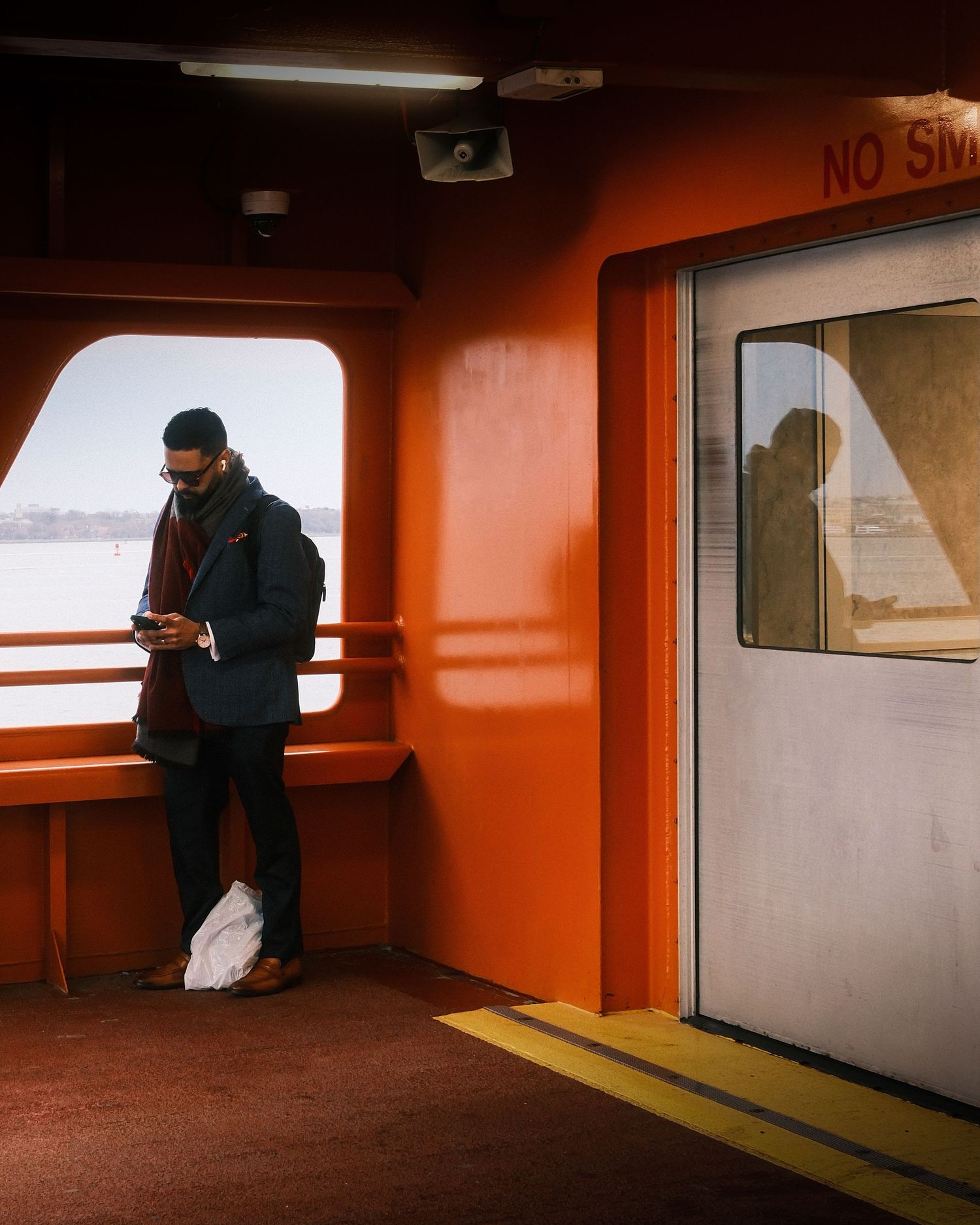 Passenger standing alone inside the Staten Island Ferry in New York City