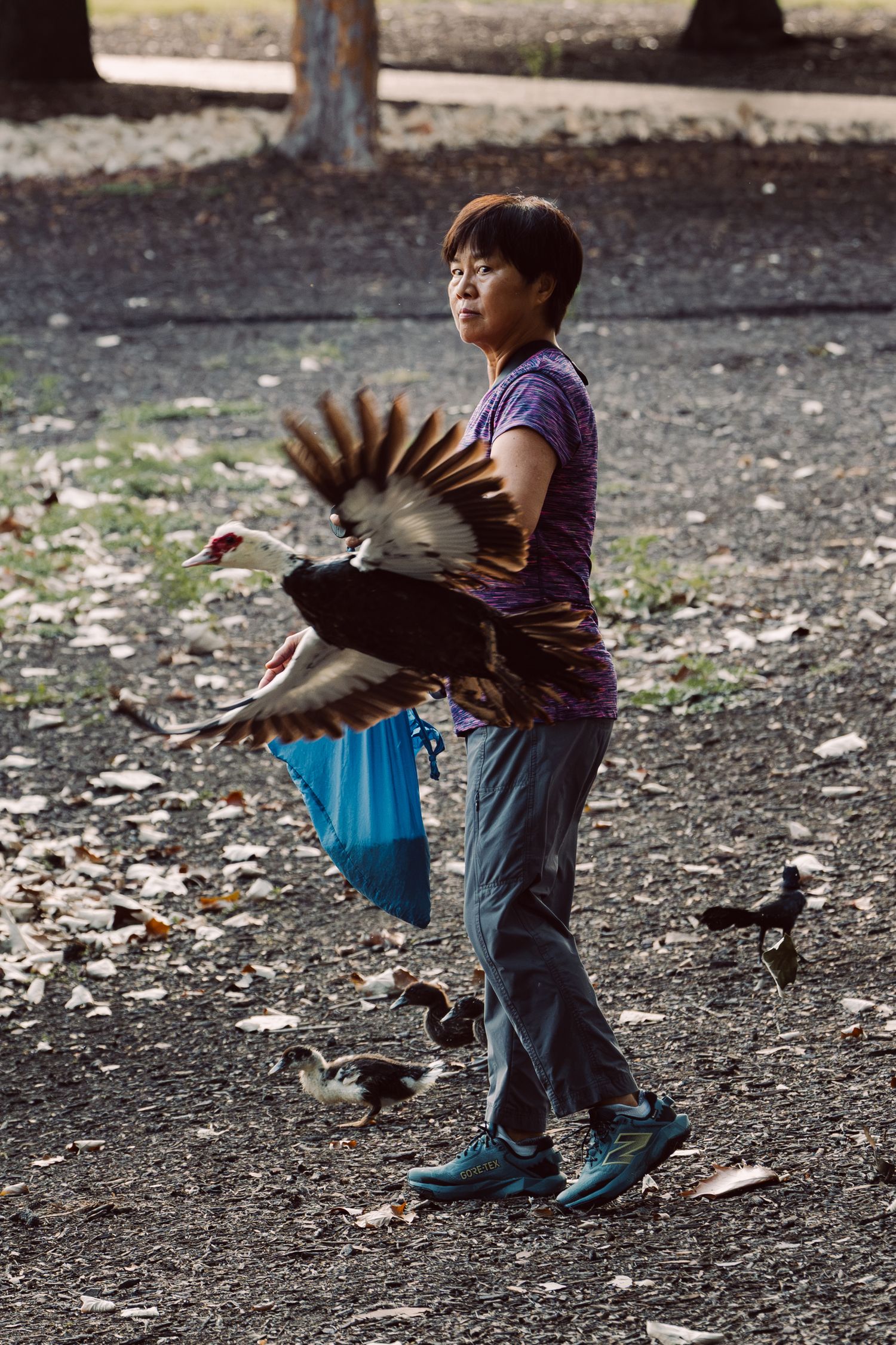 Candid photograph of a person walking through Mueller Lake Park in Austin, Texas