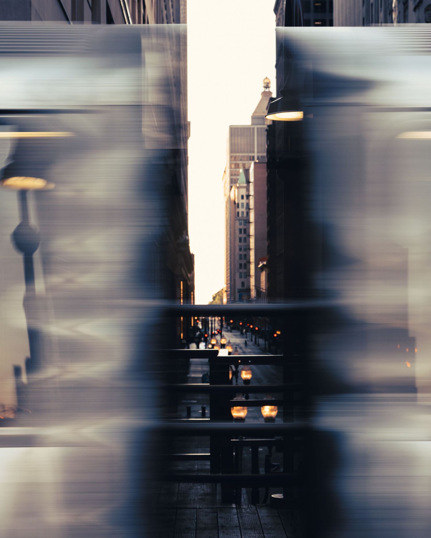 Chicago architecture framed through motion blur from an elevated CTA train platform