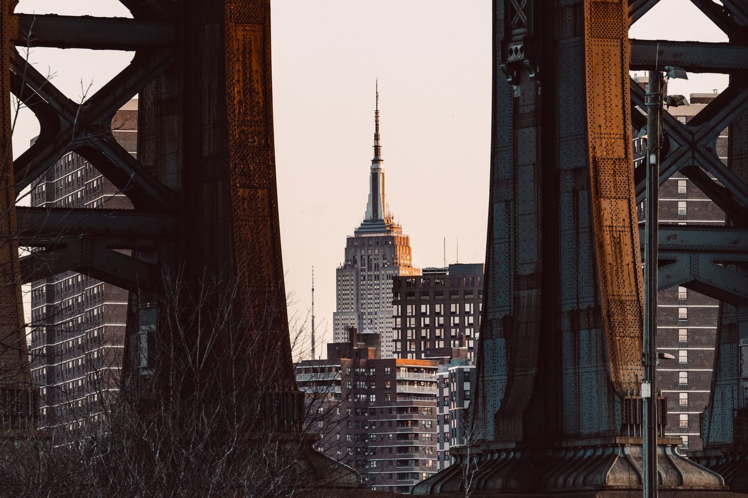Empire State Building framed beneath the Manhattan Bridge from DUMBO, Brooklyn