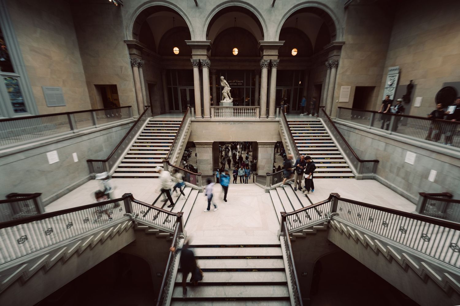 Grand interior staircase and visitors inside the Art Institute of Chicago