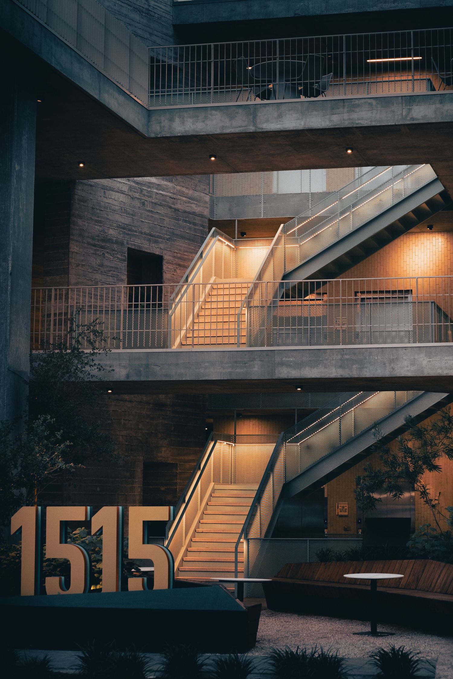 Illuminated exterior staircases and 1515 signage at the Chioco Design building in East Austin, Texas