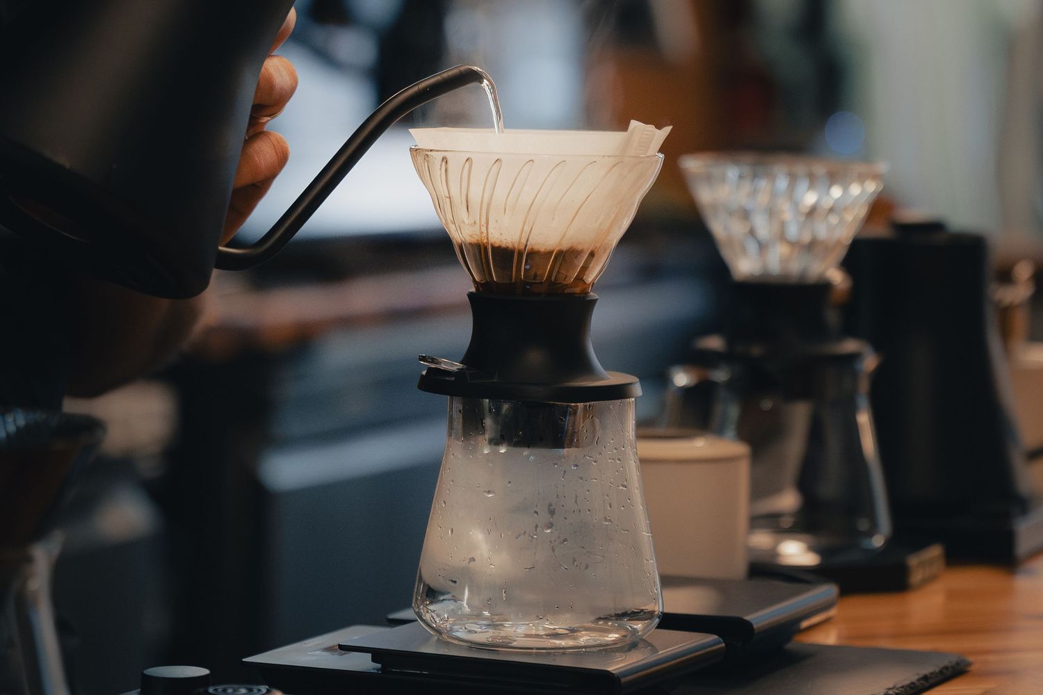Barista preparing pour-over coffee at Klerje Coffee in East Austin
