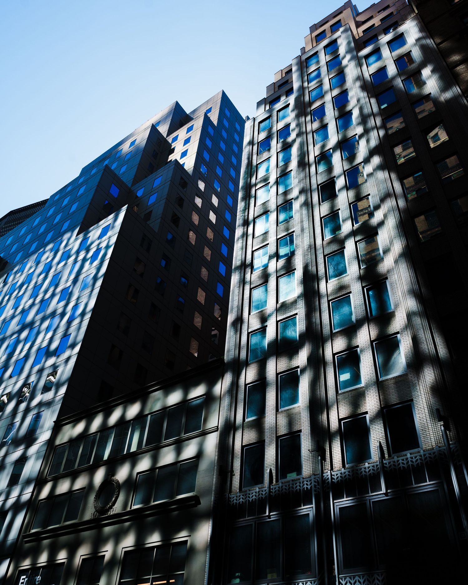 Low-angle view of modern high-rise architecture in Manhattan, New York City