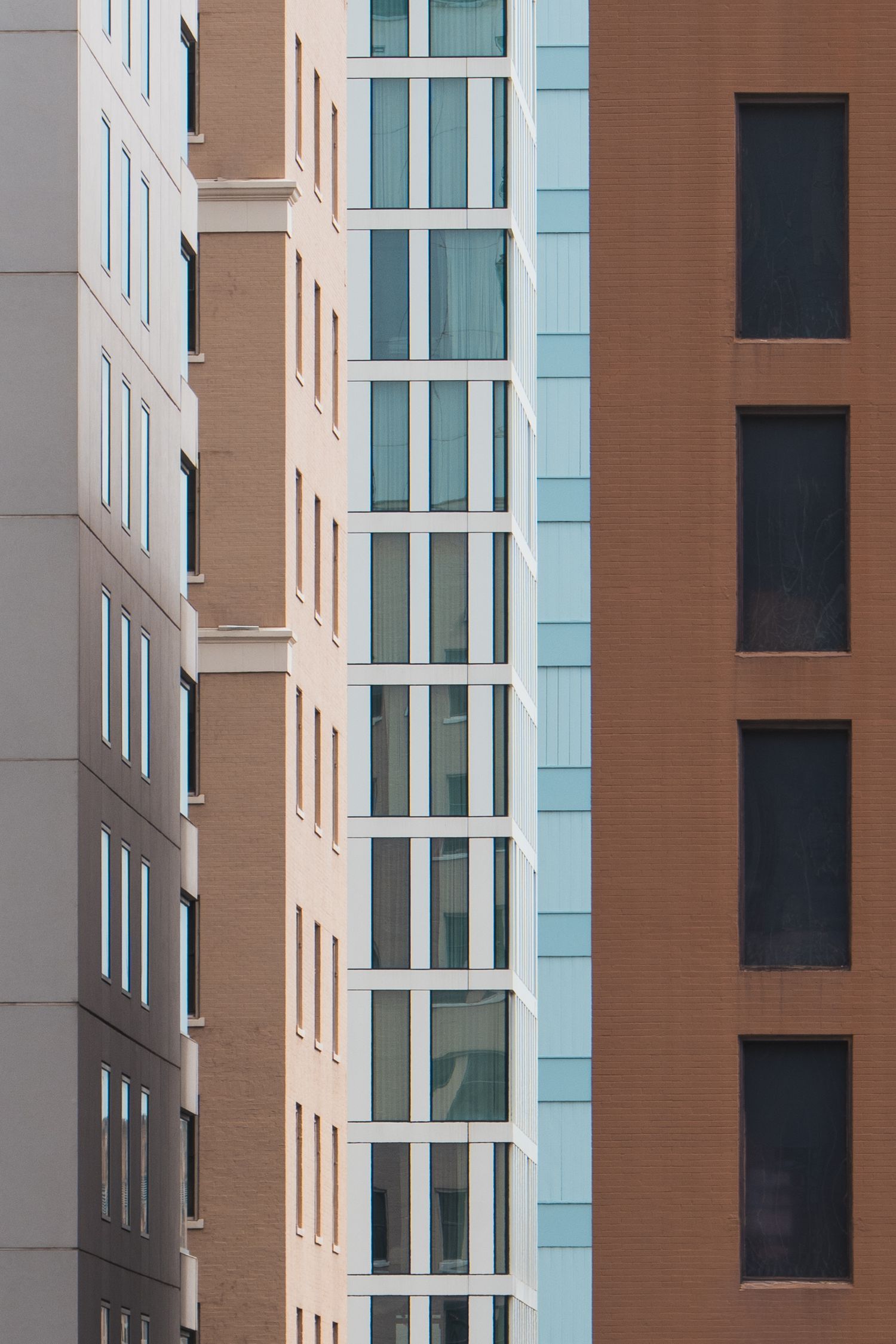 Layered facades of modern high-rise buildings in downtown Austin, Texas